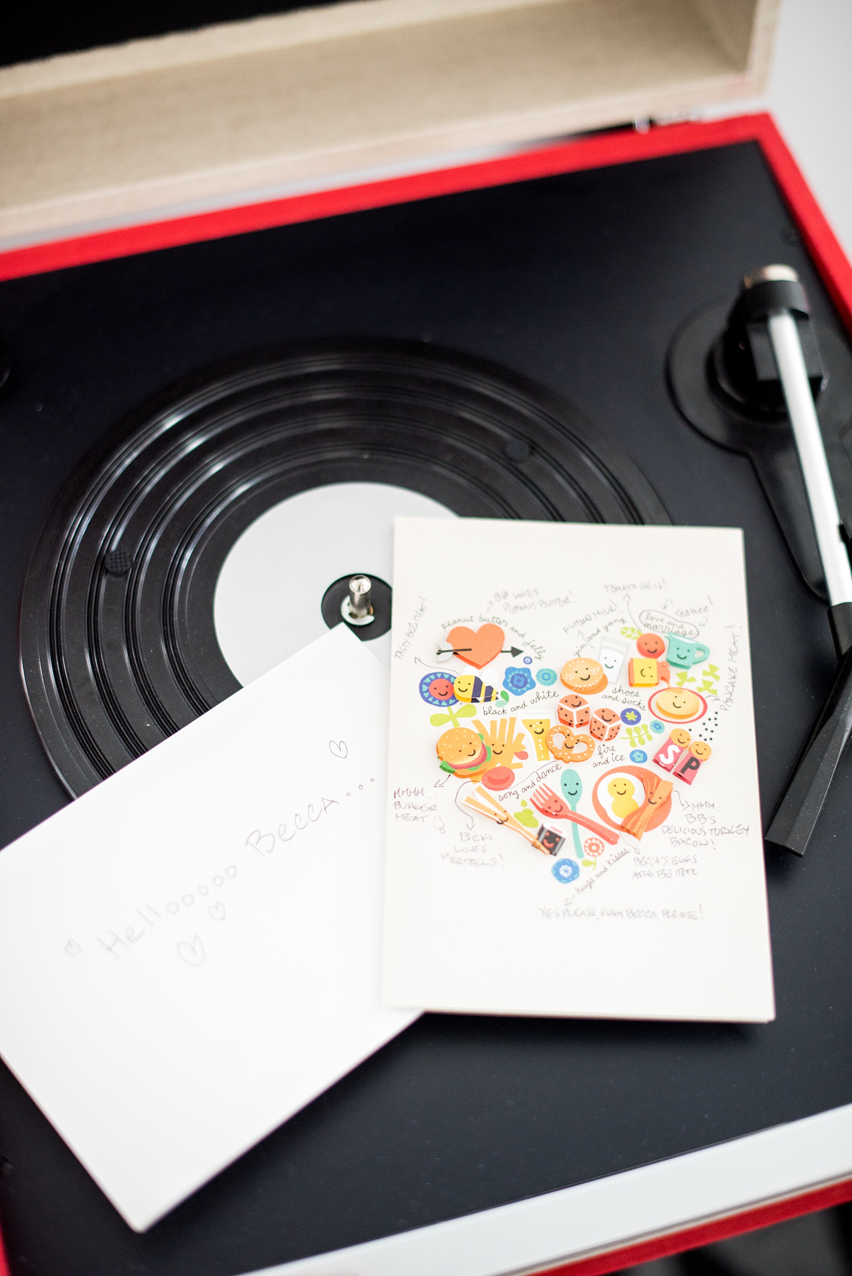 W Hoboken wedding photos by Mikkel Paige Photography at this NJ venue. Pictures in this well known New Jersey city with a view of the NYC skyline. Image of the card from the groom to the bride on top of a record player. #mikkelpaige #HobokenWedding #NewJerseyPhotographer #NewYorkCityPhotographer #NYCweddingphotographer #brideandgroomphotos #redpeonies #romanticwedding #springwedding #CityWedding