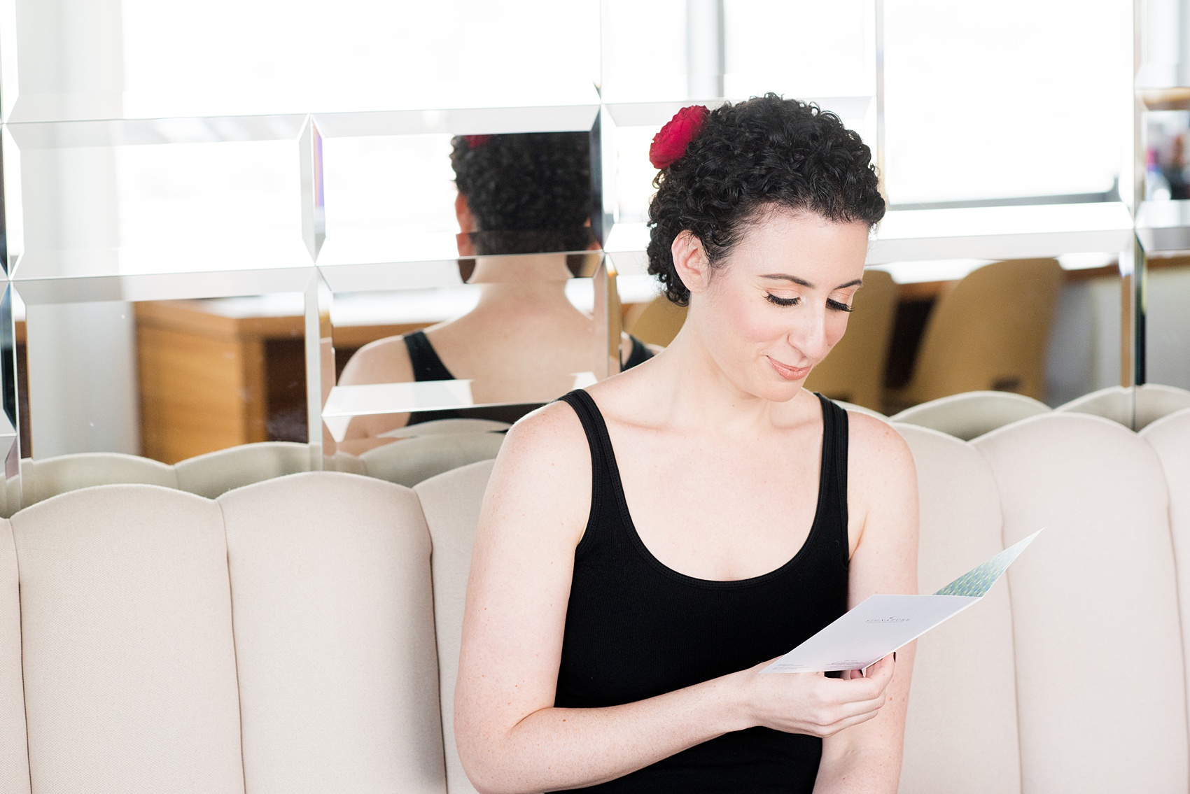 W Hoboken wedding photos by Mikkel Paige Photography. Pictures in this well known New Jersey venue with a view of the Manhattan skyline. Image of the bride reading a card from the groom during getting ready. #mikkelpaige #HobokenWedding #NewJerseyPhotographer #NewYorkCityPhotographer #NYCweddingphotographer #brideandgroomphotos #redpeonies #romanticwedding #springwedding #CityWedding