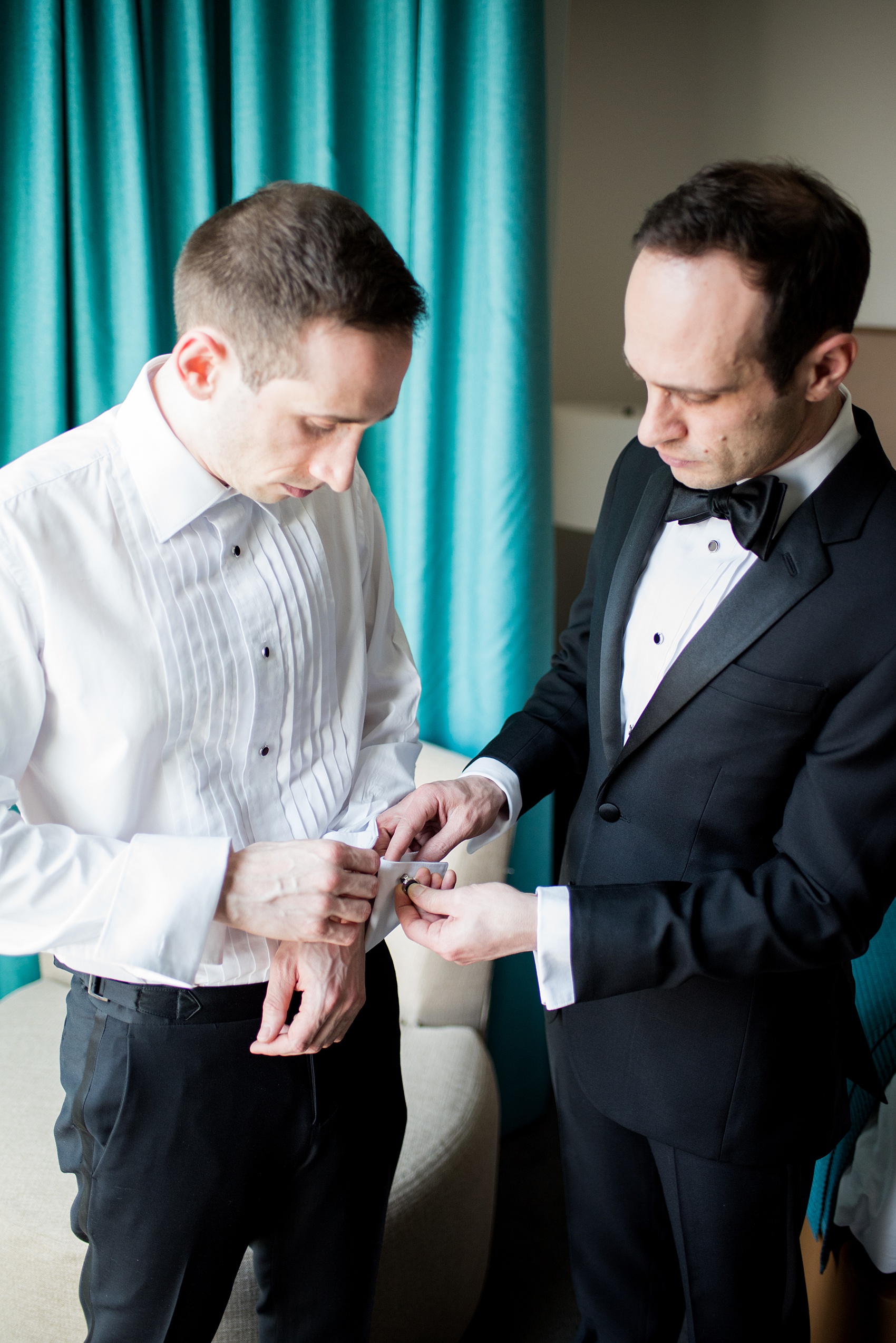 W Hoboken wedding photos by Mikkel Paige Photography. Pictures in this well known New Jersey venue with a view of the Manhattan skyline. Image of the groom and his brother during the start of the afternoon, getting ready at the Starwood hotel. #mikkelpaige #HobokenWedding #NewJerseyPhotographer #NewYorkCityPhotographer #NYCweddingphotographer #brideandgroomphotos #redpeonies #romanticwedding #springwedding #CityWedding