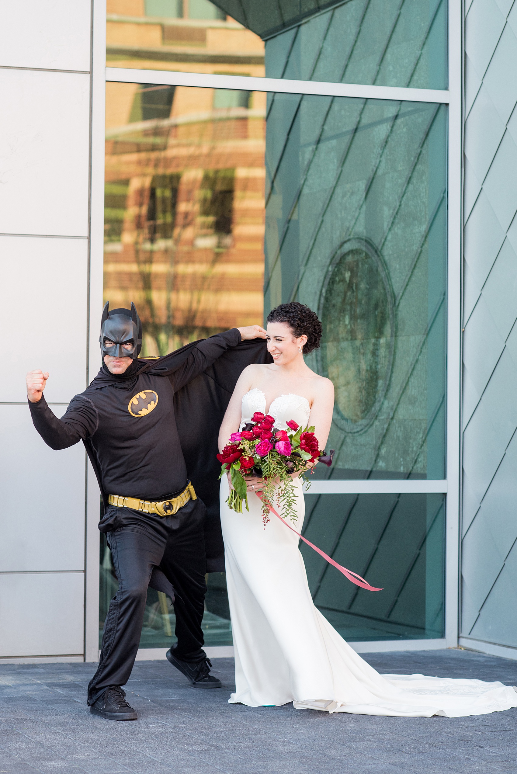 W Hoboken wedding photos by Mikkel Paige Photography. Pictures in this well known New Jersey area with a view of the Manhattan skyline. The bride took a photo with Batman outside of the venue. #mikkelpaige #HobokenWedding #NewJerseyPhotographer #NewYorkCityPhotographer #NYCweddingphotographer #brideandgroomphotos #redpeonies #romanticwedding #springwedding #CityWedding #Batman