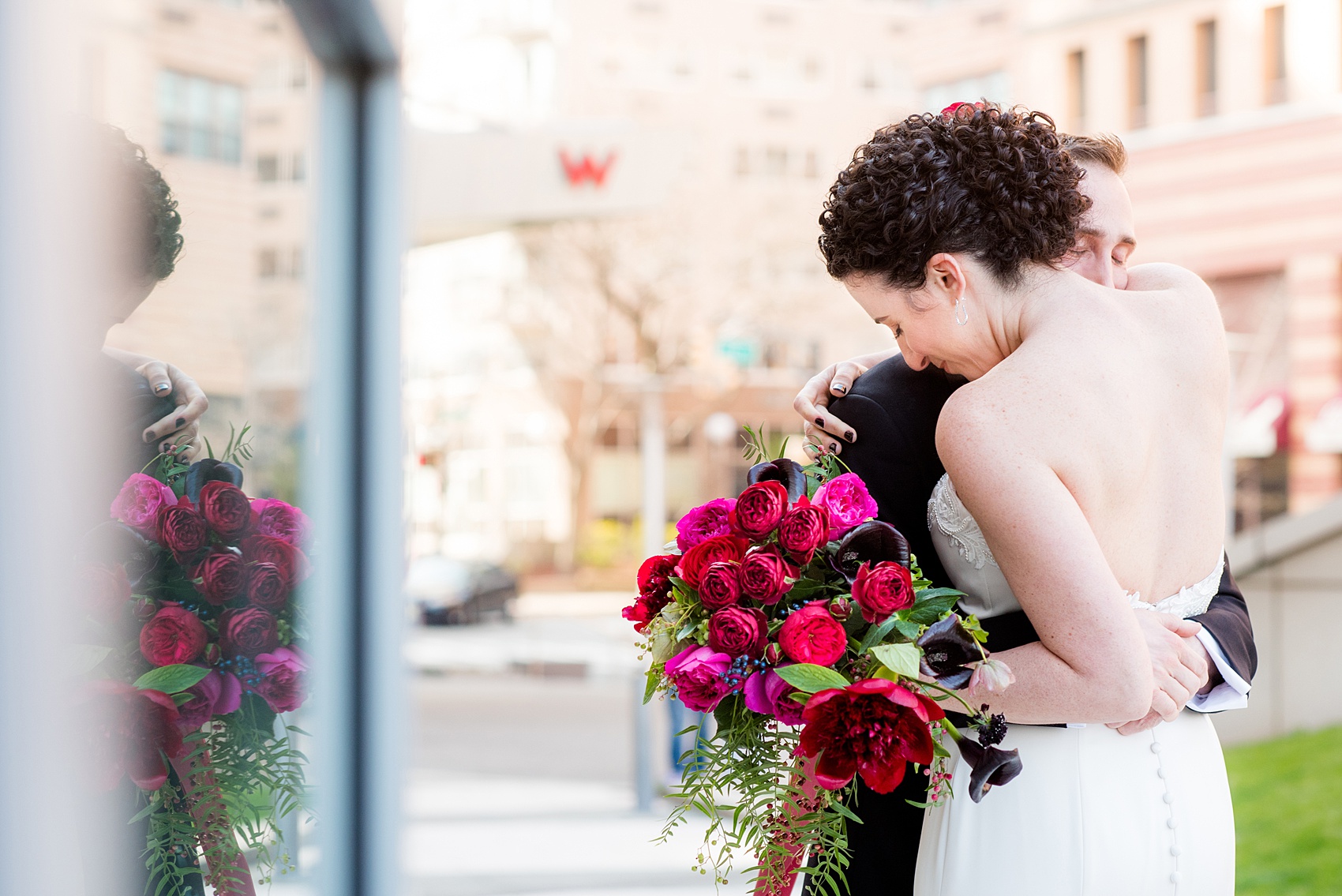 W Hoboken wedding photos by Mikkel Paige Photography at this NJ venue. Pictures in this well known New Jersey city with a view of the NYC skyline. The bride and the groom wore romantic colors including burgundy, fuchsia, red and classic black. Flowers by Sachi Rose Design. #mikkelpaige #HobokenWedding #NewJerseyPhotographer #NewYorkCityPhotographer #NYCweddingphotographer #brideandgroomphotos #redpeonies #romanticwedding #springwedding #CityWedding