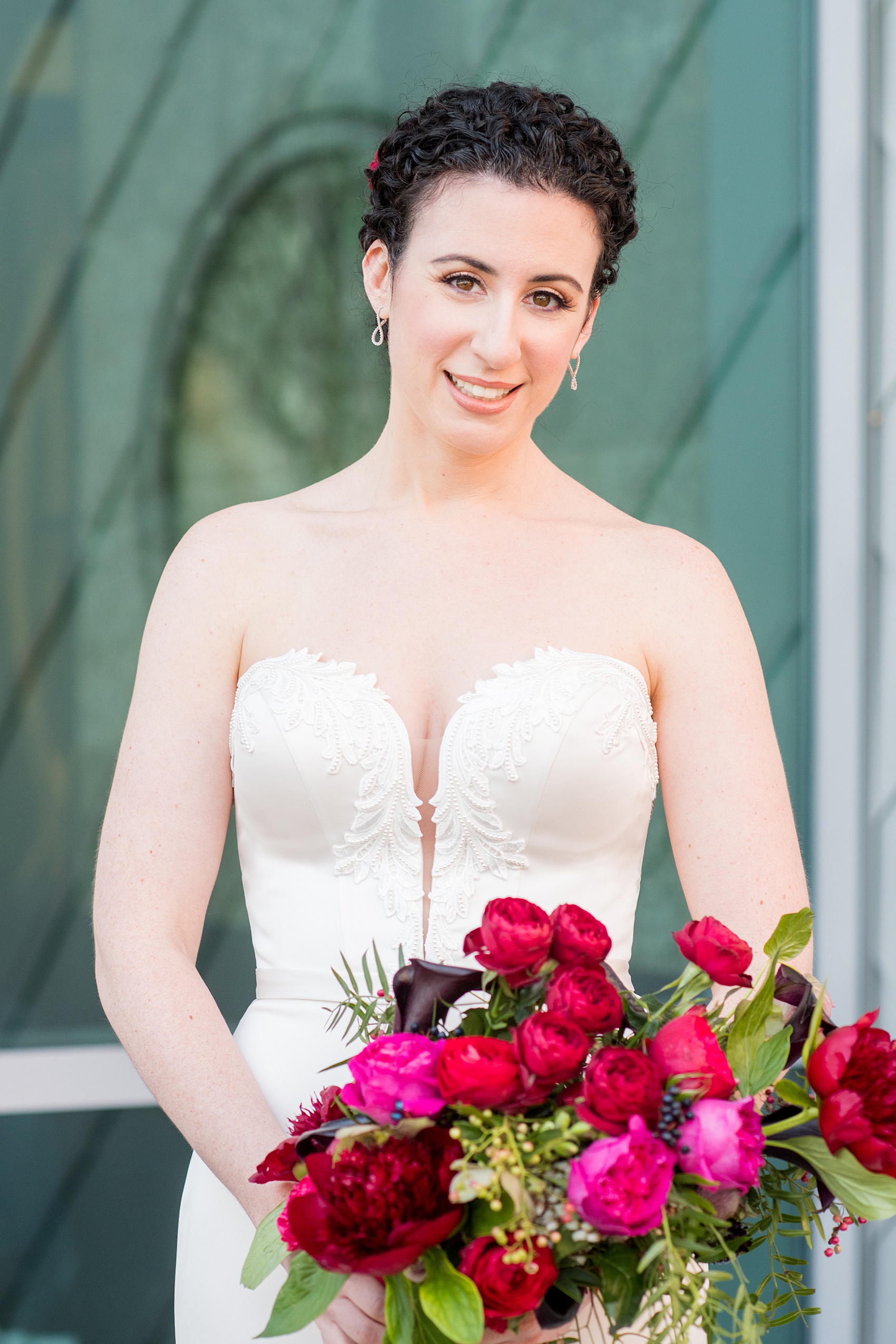 W Hoboken wedding photos by Mikkel Paige Photography at this NJ venue. Pictures in this well known New Jersey city with a view of the NYC skyline. The bride wore a sexy strapless pearl beaded gown with a romantic bouquet, including colors burgundy, fuchsia, and red. Flowers by Sachi Rose Design. #mikkelpaige #HobokenWedding #NewJerseyPhotographer #NewYorkCityPhotographer #NYCweddingphotographer #brideandgroomphotos #redpeonies #romanticwedding #springwedding #CityWedding