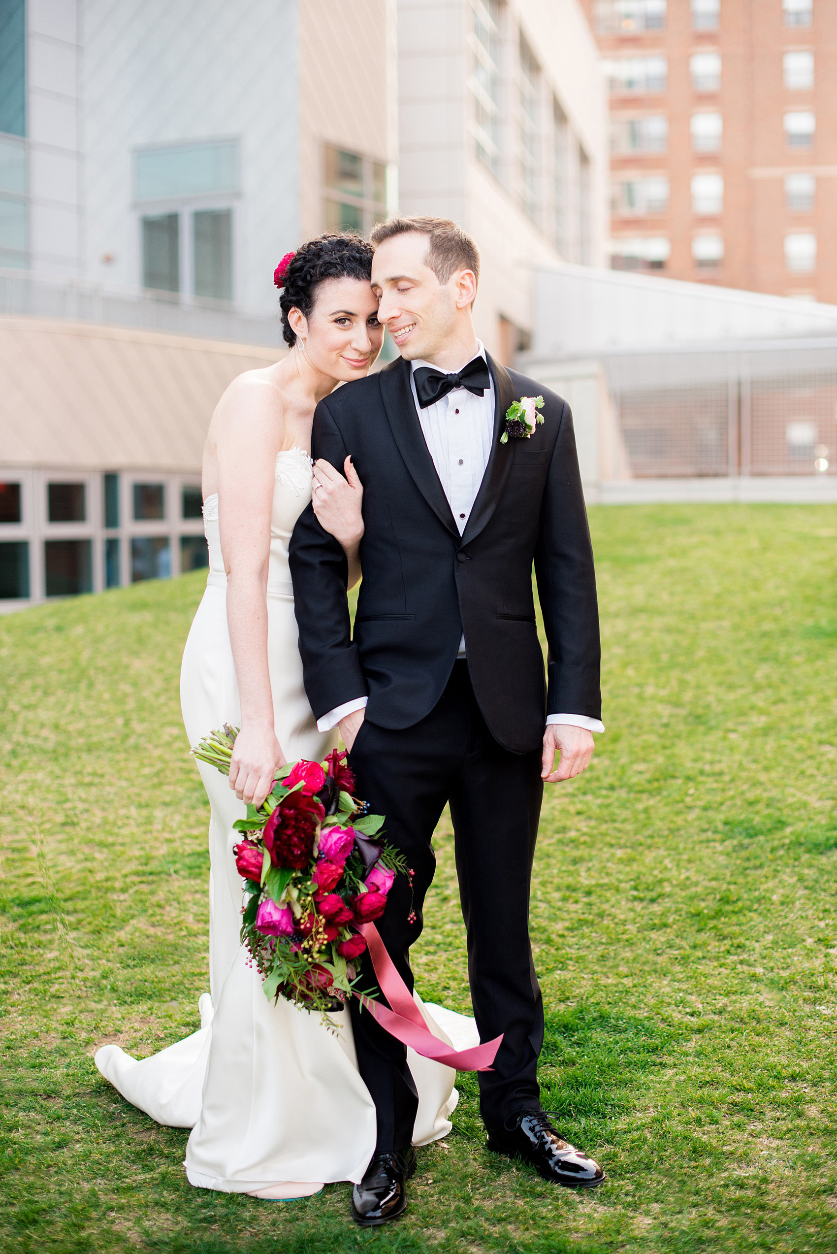 W Hoboken wedding photos at this New Jersey hotel overlooking the Manhattan skyline. Photos by Mikkel Paige Photography of the bride and groom in romantic, sexy yet classic and elegant outfits. The bride wore a strapless, pearl beaded form-fitting gown and the groom wore a classic black tuxedo. #mikkelpaige #HobokenWedding #NewJerseyPhotographer #NewYorkCityPhotographer #NYCweddingphotographer #brideandgroomphotos #redpeonies #romanticwedding #springwedding #CityWedding