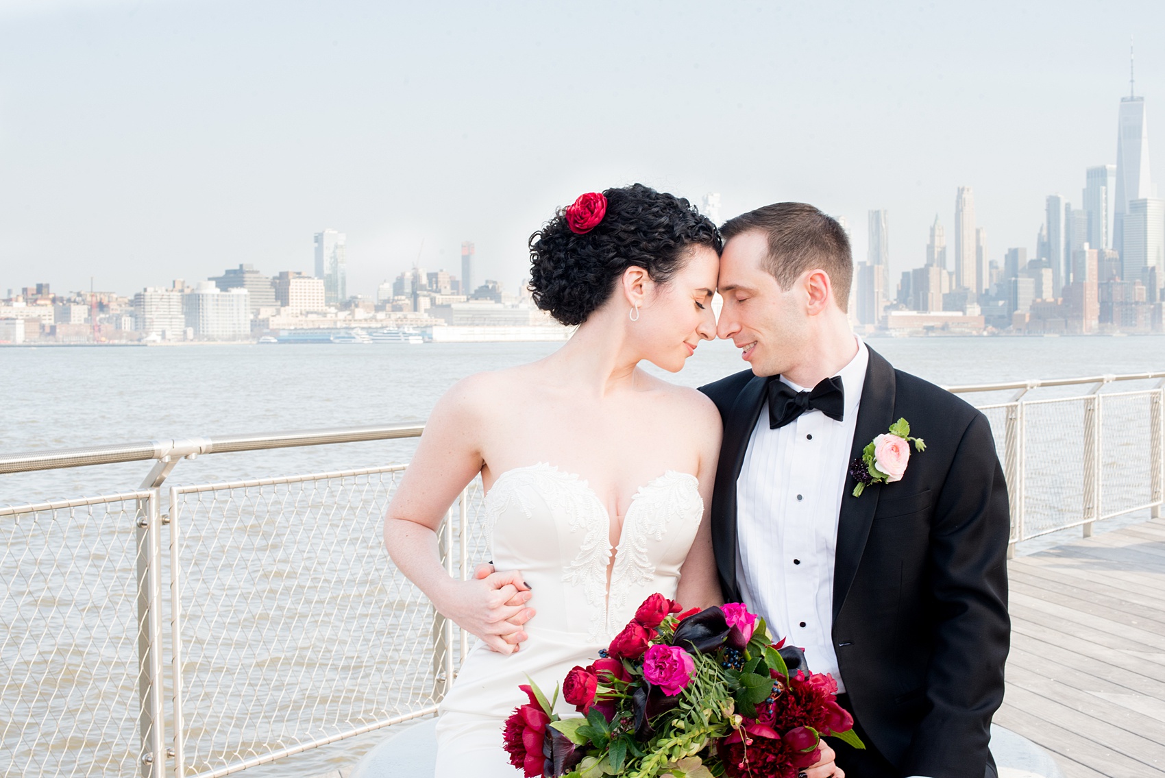 W Hoboken wedding photos by Mikkel Paige Photography. Pictures of the bride and groom in this well known New Jersey city with a view of the NYC skyline across the Hudson River. #mikkelpaige #HobokenWedding #NewJerseyPhotographer #NewYorkCityPhotographer #NYCweddingphotographer #brideandgroomphotos #redpeonies #romanticwedding #springwedding #CityWedding