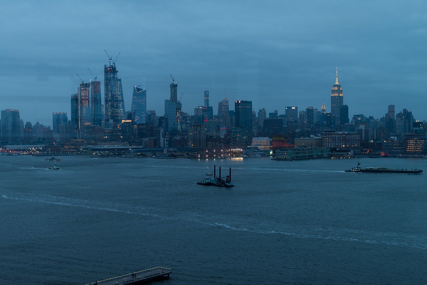 W Hoboken wedding photos at this New Jersey venue overlooking the NYC skyline. Photos by Mikkel Paige Photography of the view across the Hudson river at dusk into evening. #mikkelpaige #HobokenWedding #NewJerseyPhotographer #NewYorkCityPhotographer #NYCweddingphotographer #brideandgroomphotos #redpeonies #romanticwedding #springwedding #CityWedding 