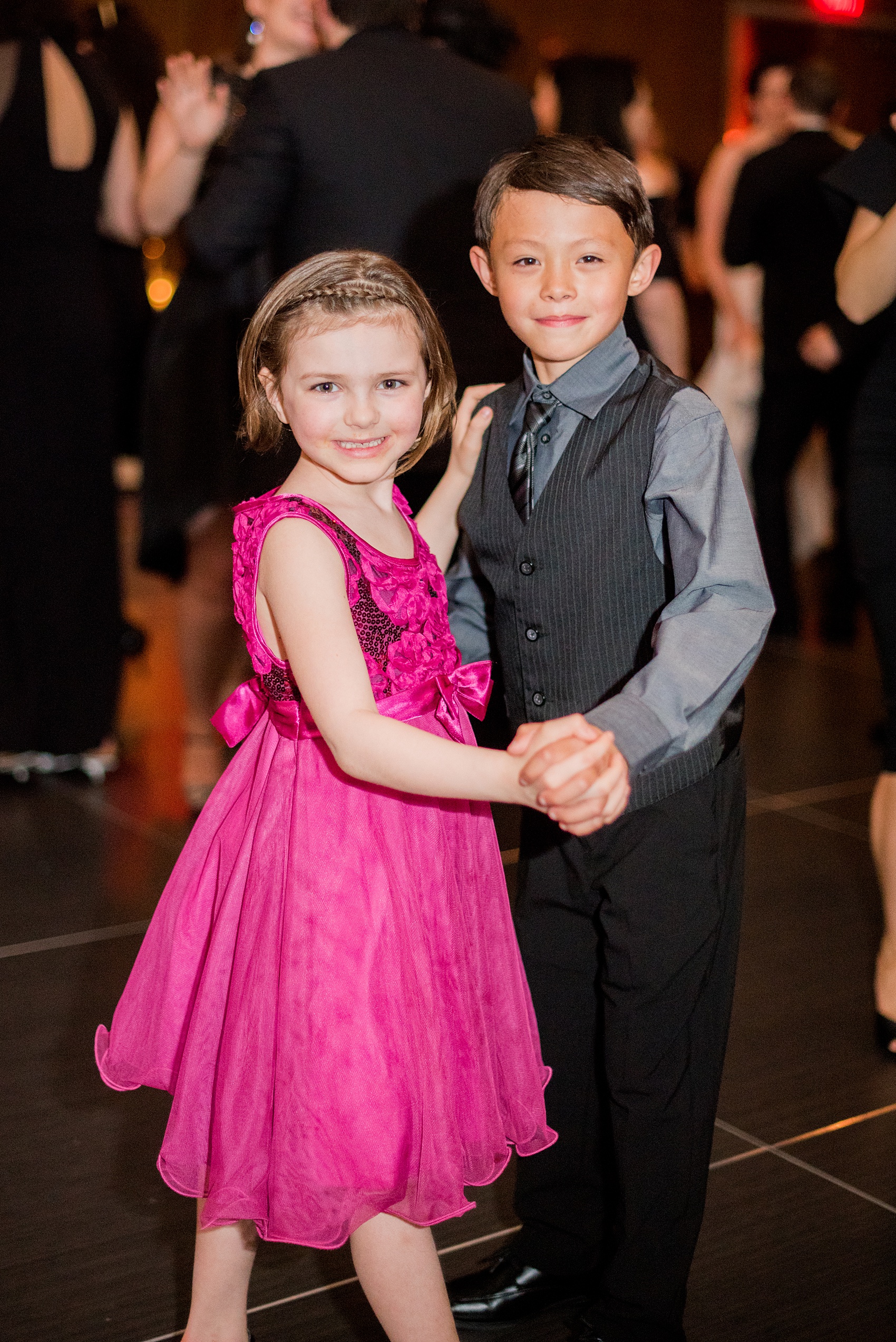 W Hoboken wedding photos at this New Jersey venue overlooking the Manhattan skyline. Photos by Mikkel Paige Photography of young love kids dancing at the reception. #mikkelpaige #HobokenWedding #NewJerseyPhotographer #NewYorkCityPhotographer #NYCweddingphotographer #brideandgroomphotos #redpeonies #romanticwedding #springwedding #CityWedding