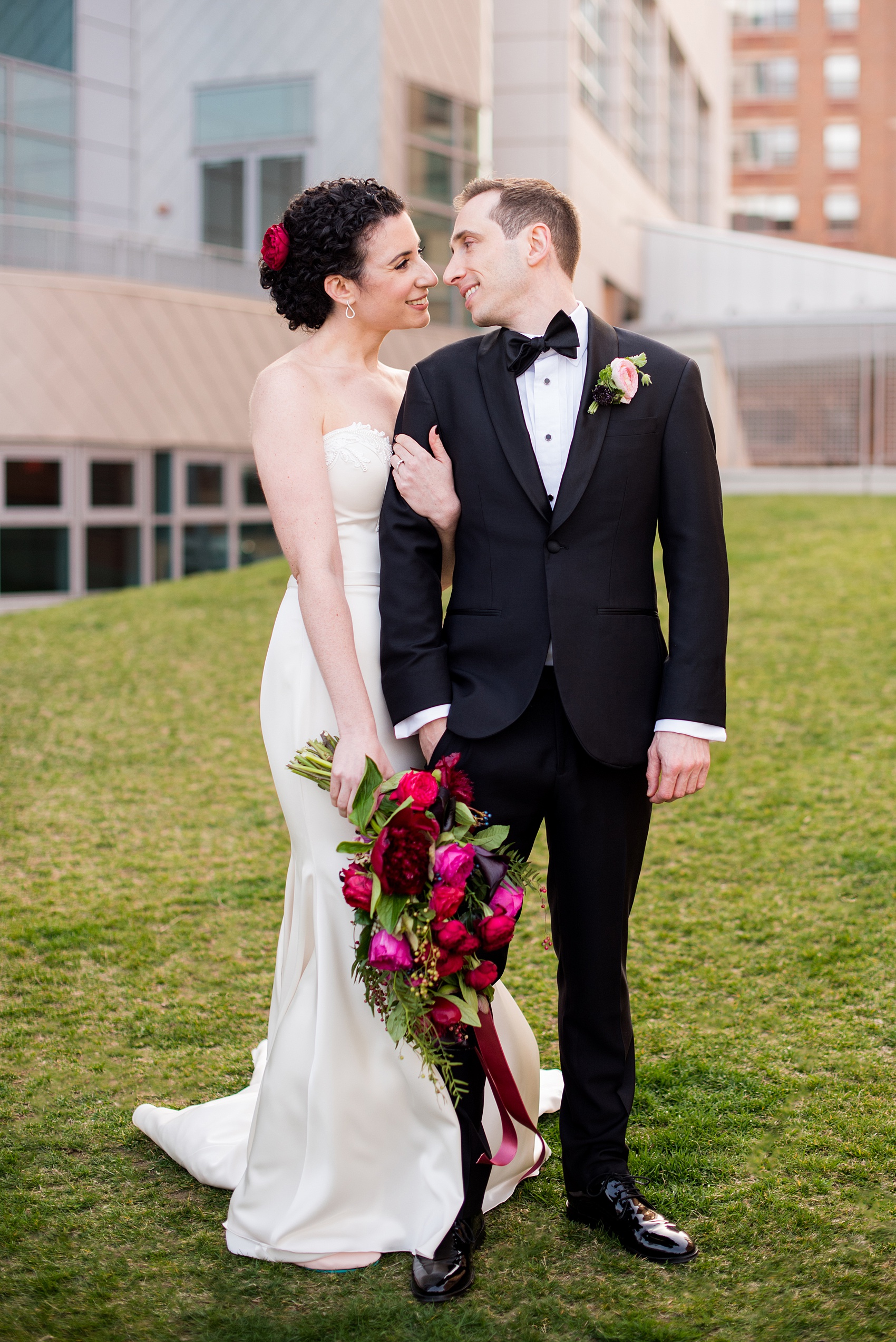 W Hoboken Wedding Photos by Mikkel Paige Photography. Spring wedding overlooking the NYC skyline, with a sexy black, deep red, burgundy and fuchsia color palette. Picture of the bride and groom during golden hour. #HobokenWedding #mikkelpaige #springwedding #romanticwedding #NewJerseyWeddingPhotos