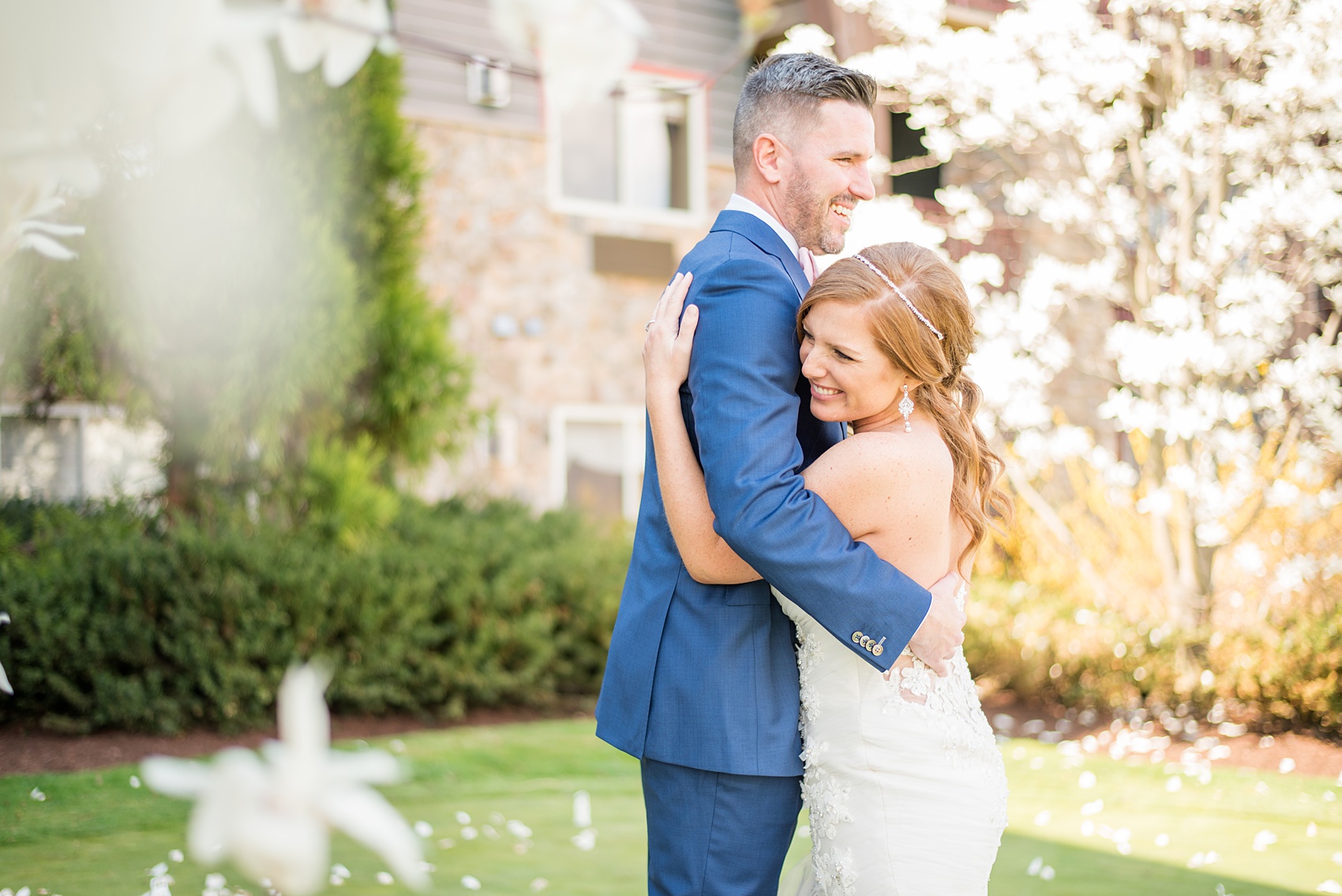 Crystal Springs Resort wedding photos in New Jersey, with photographer Mikkel Paige Photography. The couple’s spring wedding had an outdoor ceremony with photos at this rustic, woodsy venue showing their blue and pink palette decor from getting ready to their reception. This picture shows the bride and groom hugging after their first look amongst the Cherry Blossoms. Click through to see their complete wedding recap! #NewJerseywedding #MikkelPaige #NJweddingphotographer #NJphotographer #firstlook #brideandgroom #springwedding