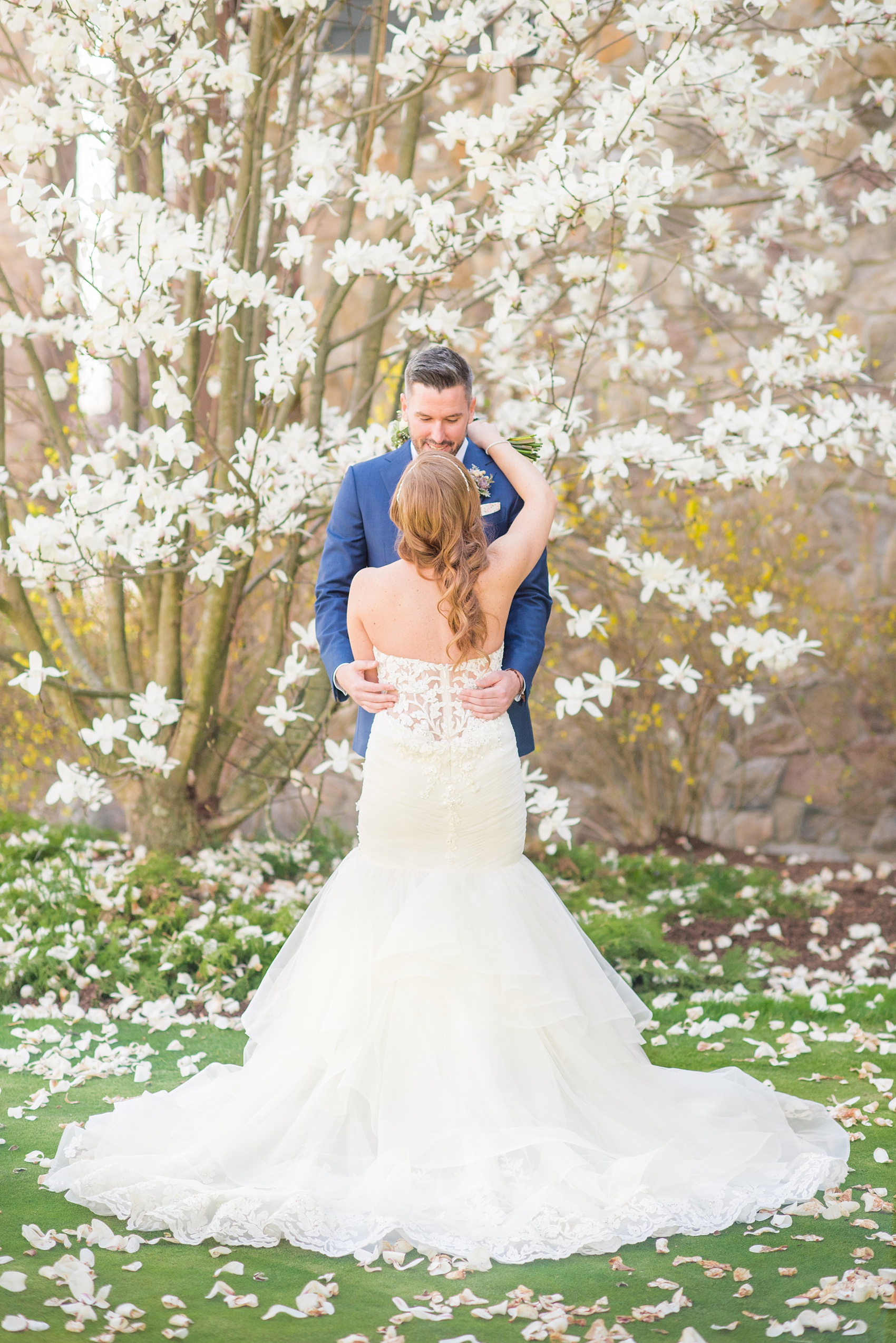 Crystal Springs Resort wedding photos in New Jersey, with photographer Mikkel Paige Photography. The couple’s spring wedding had an outdoor ceremony with photos at this rustic, woodsy venue showing their blue and pink palette decor from getting ready to their reception. This picture shows the bride and groom hugging after their first look amongst the Cherry Blossoms. Click through to see their complete wedding recap! #NewJerseywedding #MikkelPaige #NJweddingphotographer #NJphotographer #firstlook #brideandgroom #springwedding