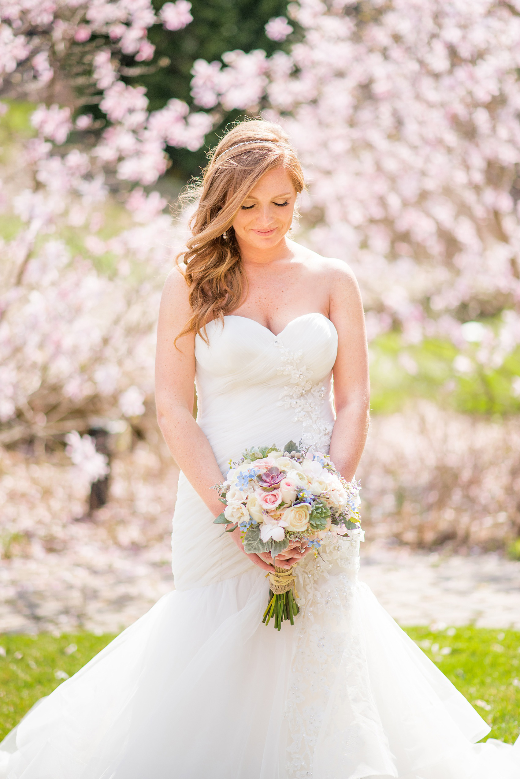 Crystal Springs Resort wedding photos in New Jersey, with photographer Mikkel Paige Photography. The couple’s spring wedding had an outdoor ceremony with photos at this rustic, woodsy venue showing their blue and pink palette decor from getting ready to their reception. The bride's love and laughter echoed through the day with spring flowers like cherry blossoms in their pictures! Click through to see their complete wedding recap! #NewJerseywedding #MikkelPaige #NJweddingphotographer #NJphotographer