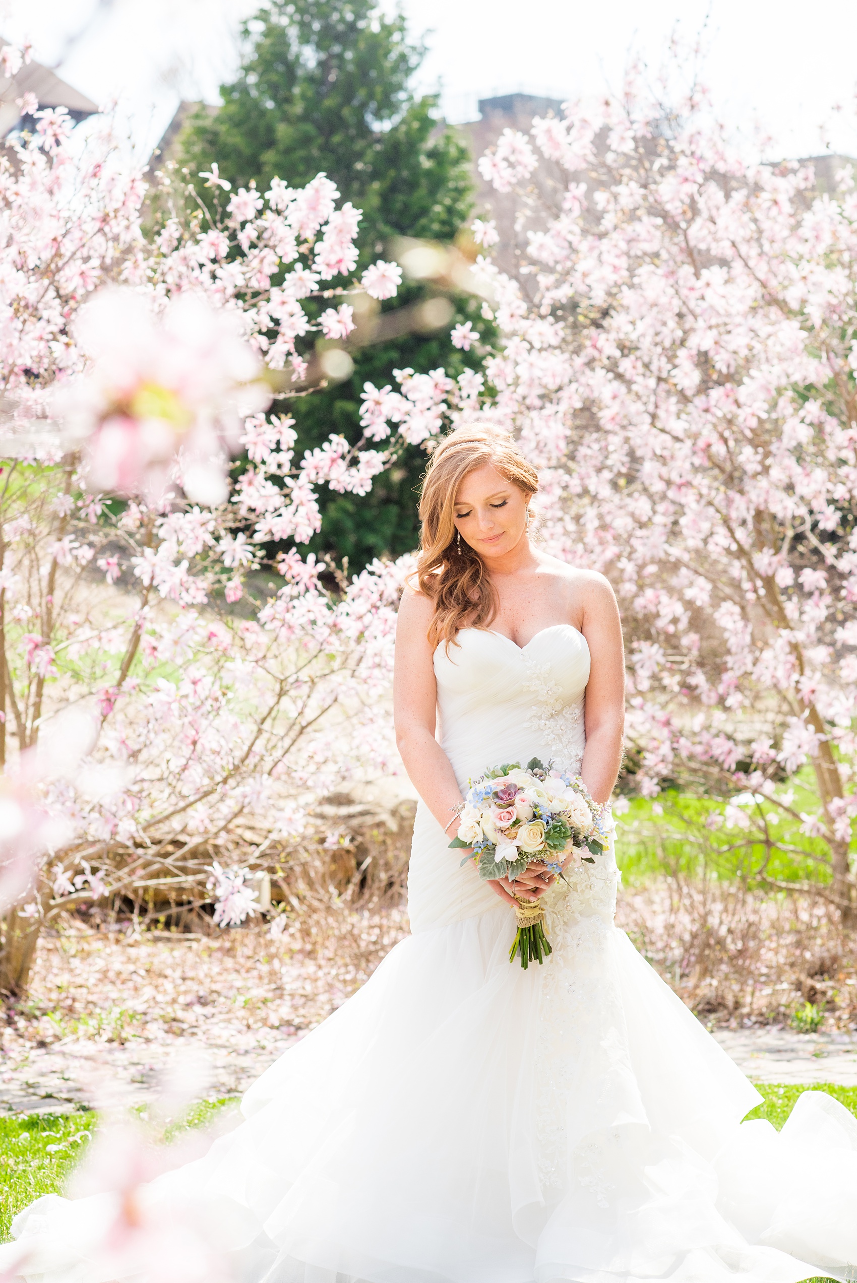 Crystal Springs Resort wedding photos in New Jersey, with photographer Mikkel Paige Photography. The couple’s spring wedding had an outdoor ceremony with photos at this rustic, woodsy venue showing their blue and pink palette decor from getting ready to their reception. The bride's love and laughter echoed through the day with spring flowers like cherry blossoms in their pictures! Click through to see their complete wedding recap! #NewJerseywedding #MikkelPaige #NJweddingphotographer #NJphotographer