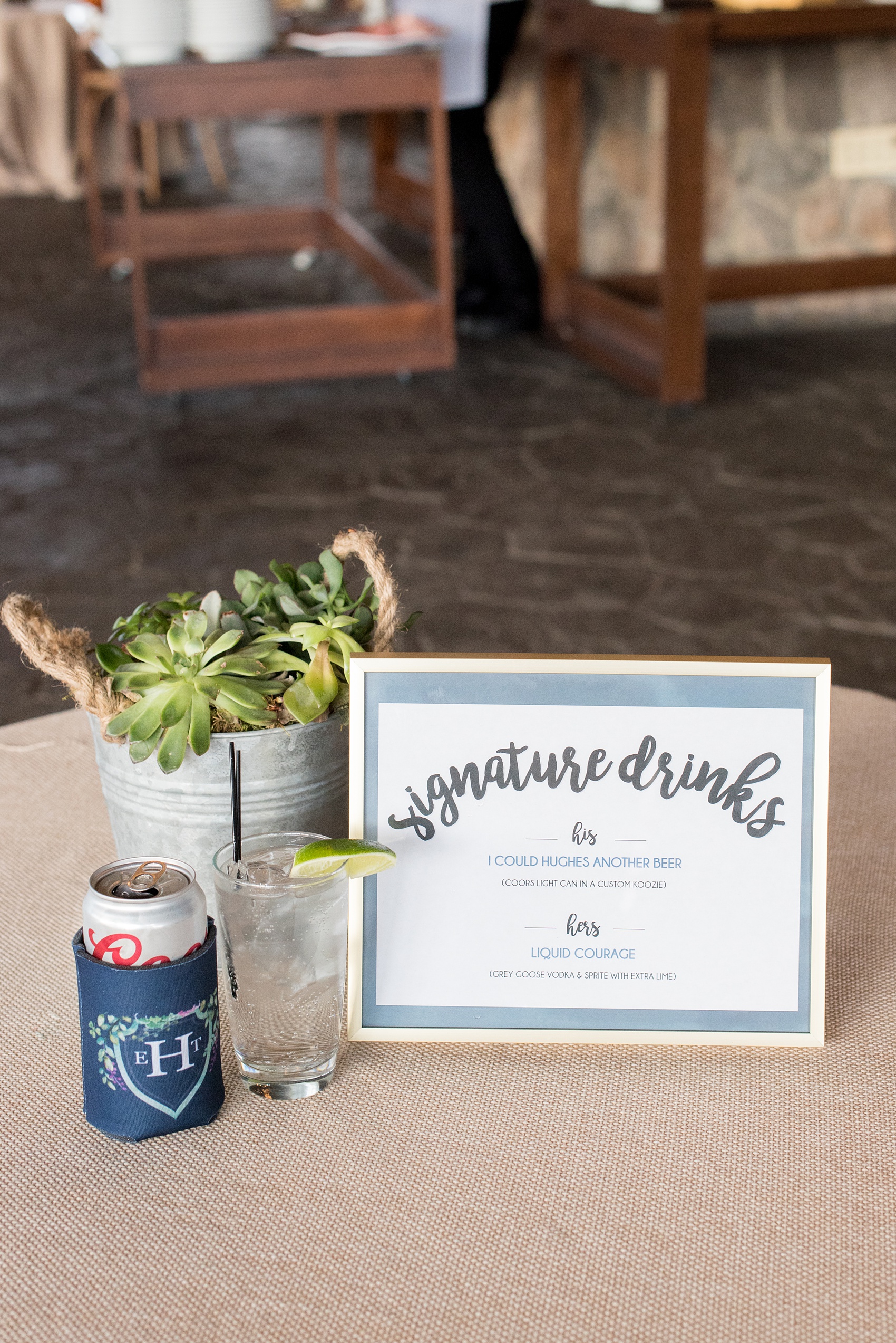 Crystal Springs Resort wedding photos in New Jersey, with photographer Mikkel Paige Photography. The couple’s spring wedding had an outdoor ceremony with photos at this rustic, woodsy venue showing their blue and pink palette decor from getting ready to their reception. This photo shows the couple's custom koozies and signature drinks sign. Click through to see their complete wedding recap! #NewJerseywedding #MikkelPaige #NJweddingphotographer #NJphotographer #springwedding #pinkandblue #cocktailhour #signaturedrink