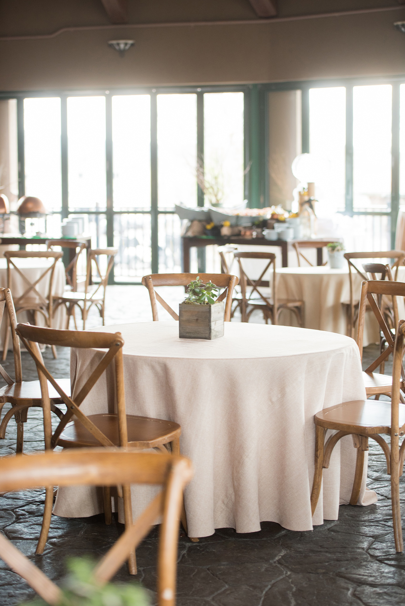 Crystal Springs Resort wedding photos in New Jersey, with photographer Mikkel Paige Photography. The couple’s spring wedding had an outdoor ceremony with photos at this rustic, woodsy venue showing their blue and pink palette decor from getting ready to their reception. This photo shows the cocktail hour tables and chairs with succulent centerpieces. Click through to see their complete wedding recap! #NewJerseywedding #MikkelPaige #NJweddingphotographer #NJphotographer #springwedding #pinkandblue #cocktailhour #succulents