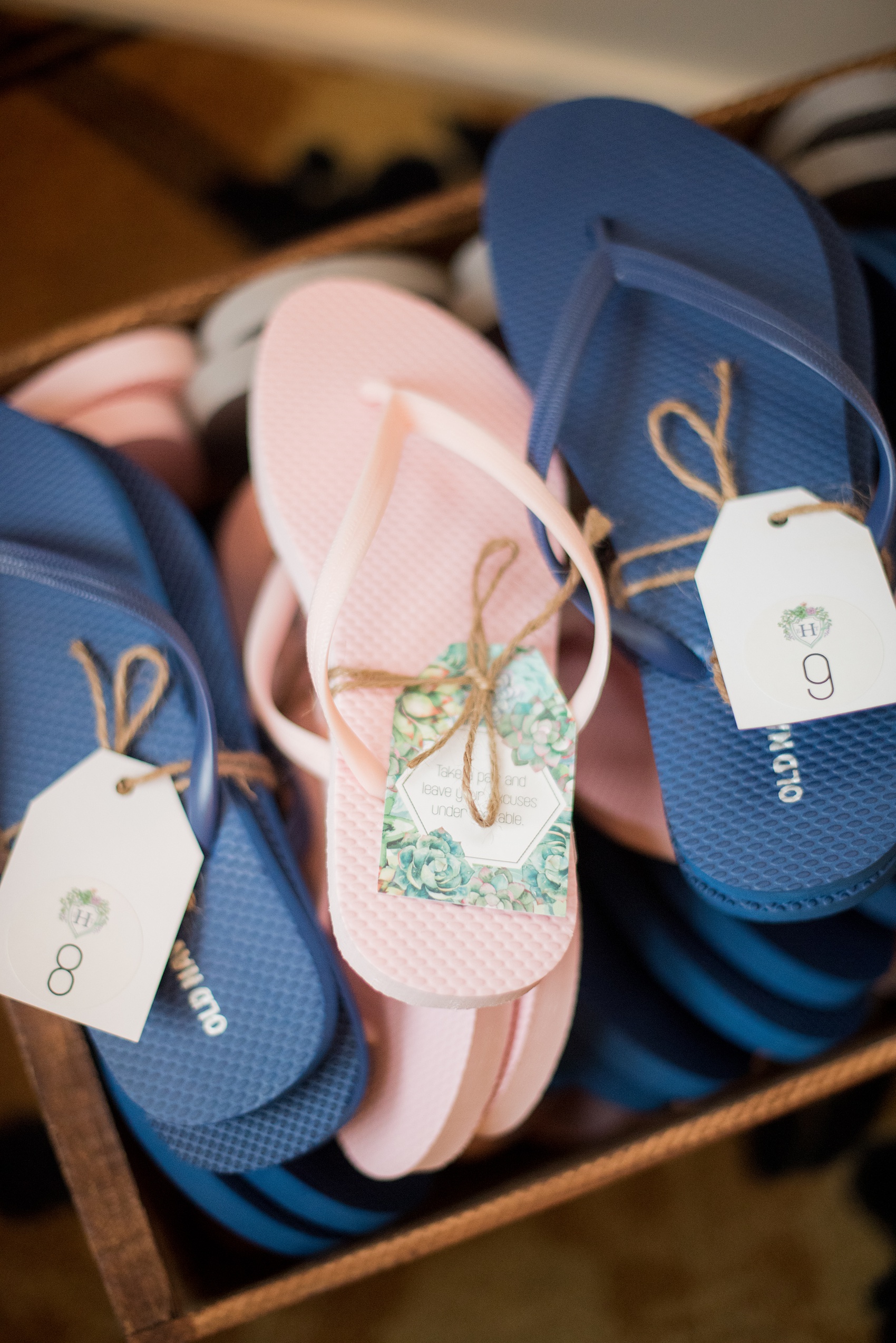 Crystal Springs Resort wedding photos in New Jersey, with photographer Mikkel Paige Photography. The couple’s spring wedding had an outdoor ceremony with photos at this rustic, woodsy venue showing their blue and pink palette decor from getting ready to their reception. This picture shows the flip flops the bride and groom provided for guests on the dance floor. Click through to see their complete wedding recap and more inspiration like this! #NewJerseywedding #MikkelPaige #NJweddingphotographer #NJphotographer #springwedding #pinkandblue #weddingflipflops #weddingreceptionideas
