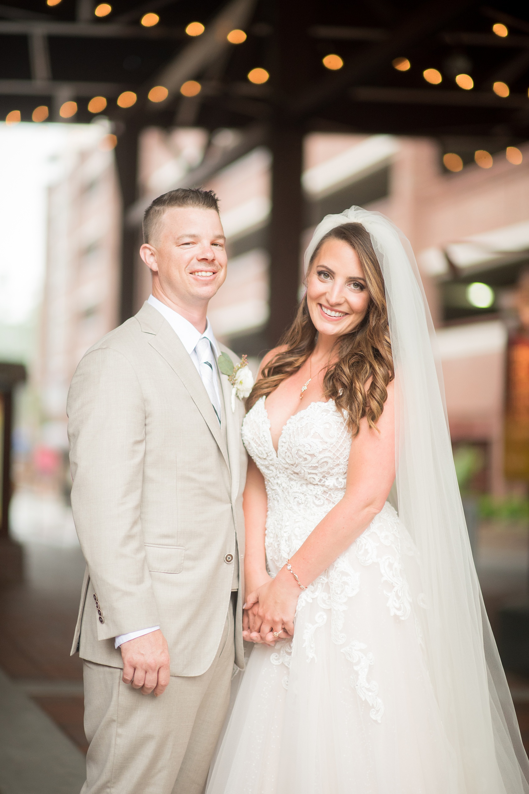 The Rickhouse wedding photos by Mikkel Paige photography in Durham, North Carolina. This urban venue has all the charm of the south for this bride and groom's spring wedding! This picture shows the bride and groom at American Tobacco Campus right after their first look. Click to see more from their day! #mikkelpaige #northcarolina #southernwedding #TheRickhouseDurham #rosegoldandpink #brideandgroom