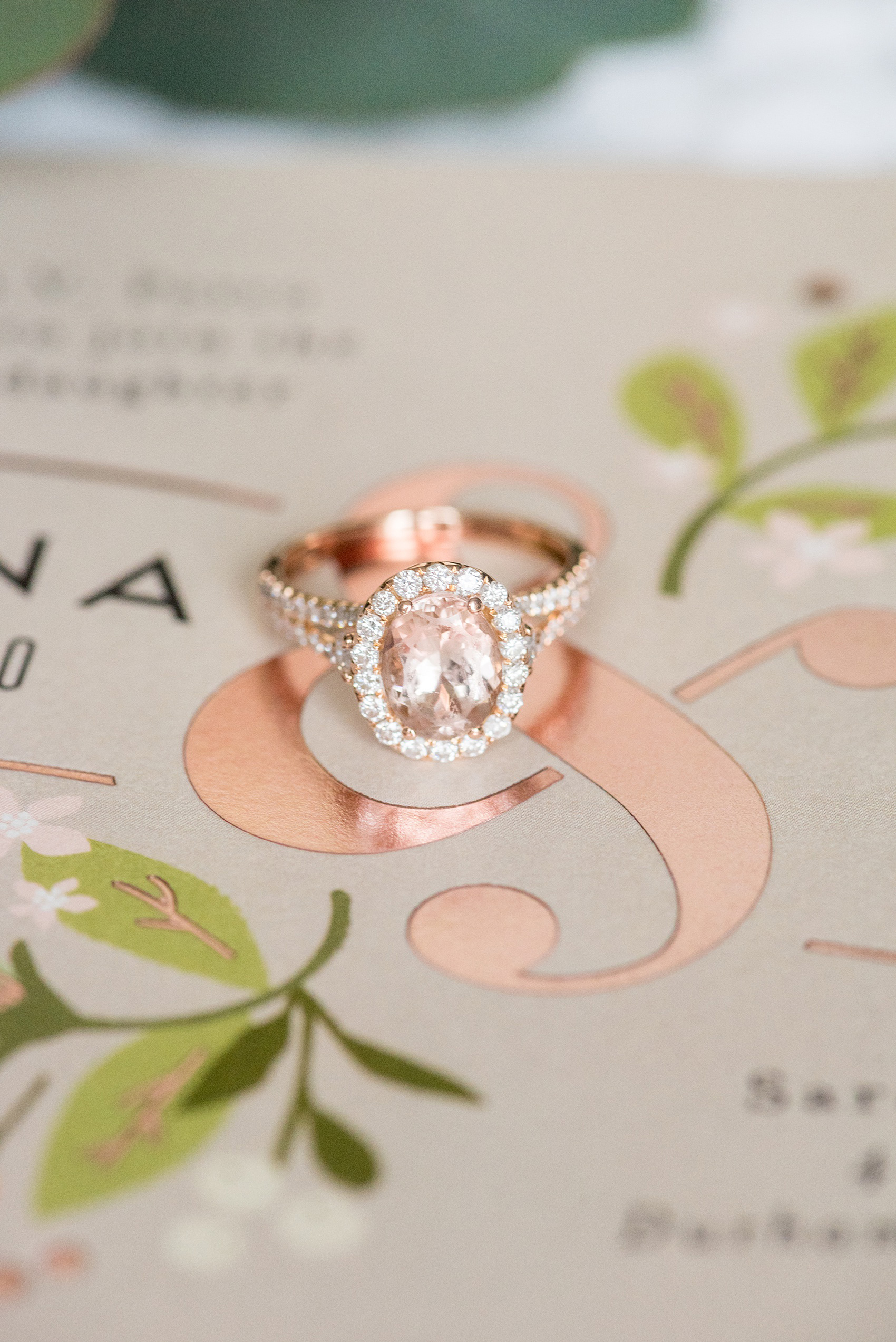 The Rickhouse wedding photos by Mikkel Paige photography in Durham, North Carolina. This urban venue has all the charm of the south for this bride and groom's spring wedding! This detail picture shows the bride and groom's copper foil Minted invitation ampersand with the bride's pink morganite stone (in lieu of a pink diamond) engagement ring in rose gold. Click to see more from their day! #mikkelpaige #northcarolina #southernwedding #TheRickhouseDurham #rosegoldandpink #morganite #pinkdiamond