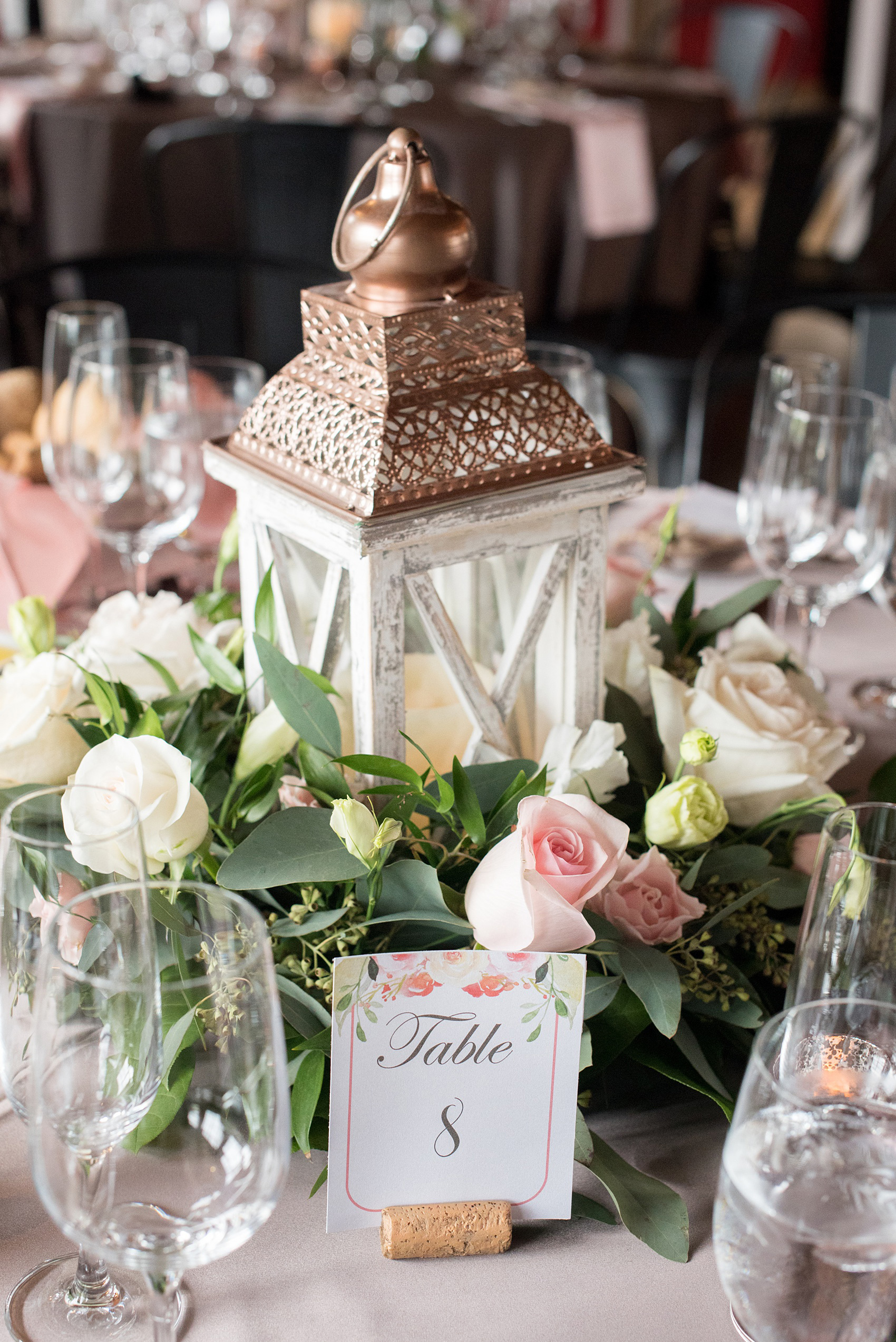 The Rickhouse wedding photos by Mikkel Paige photography in Durham, North Carolina. This urban venue has all the charm of the south for this bride and groom's spring wedding! This picture shows the reception tables, dressed in champagne linens with pink napkins, with lanterns in the middle decorated with flowers for centerpieces. Click to see more from their day! #mikkelpaige #northcarolina #southernwedding #TheRickhouseDurham #rosegoldandpink 