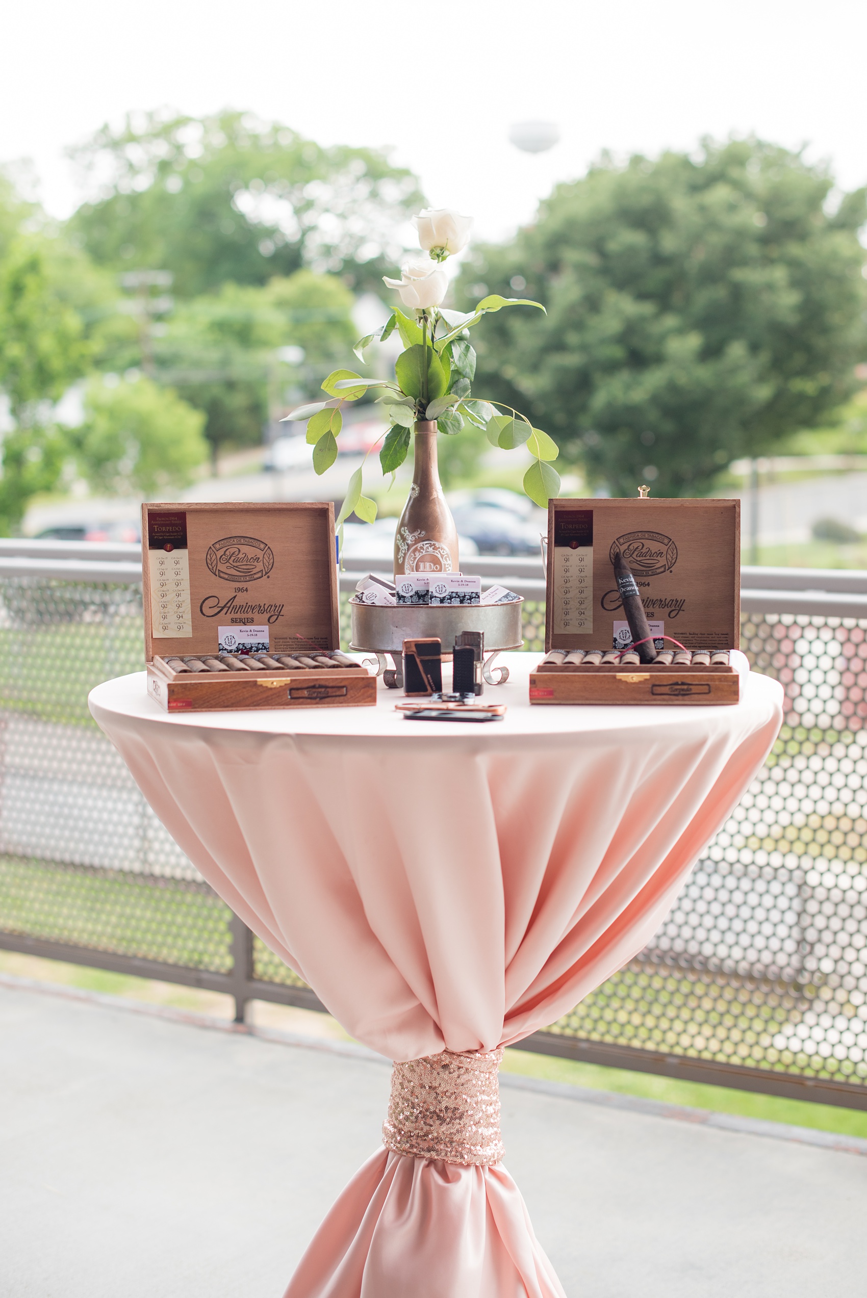 The Rickhouse wedding photos by Mikkel Paige photography in Durham, North Carolina. This urban venue has all the charm of the south for this bride and groom's spring wedding! This picture shows their cigar bar with custom labels and matches. Click through to see more gorgeous details from their day. #mikkelpaige #northcarolina #southernwedding #TheRickhouseDurham #rosegoldandpink #cigarbar