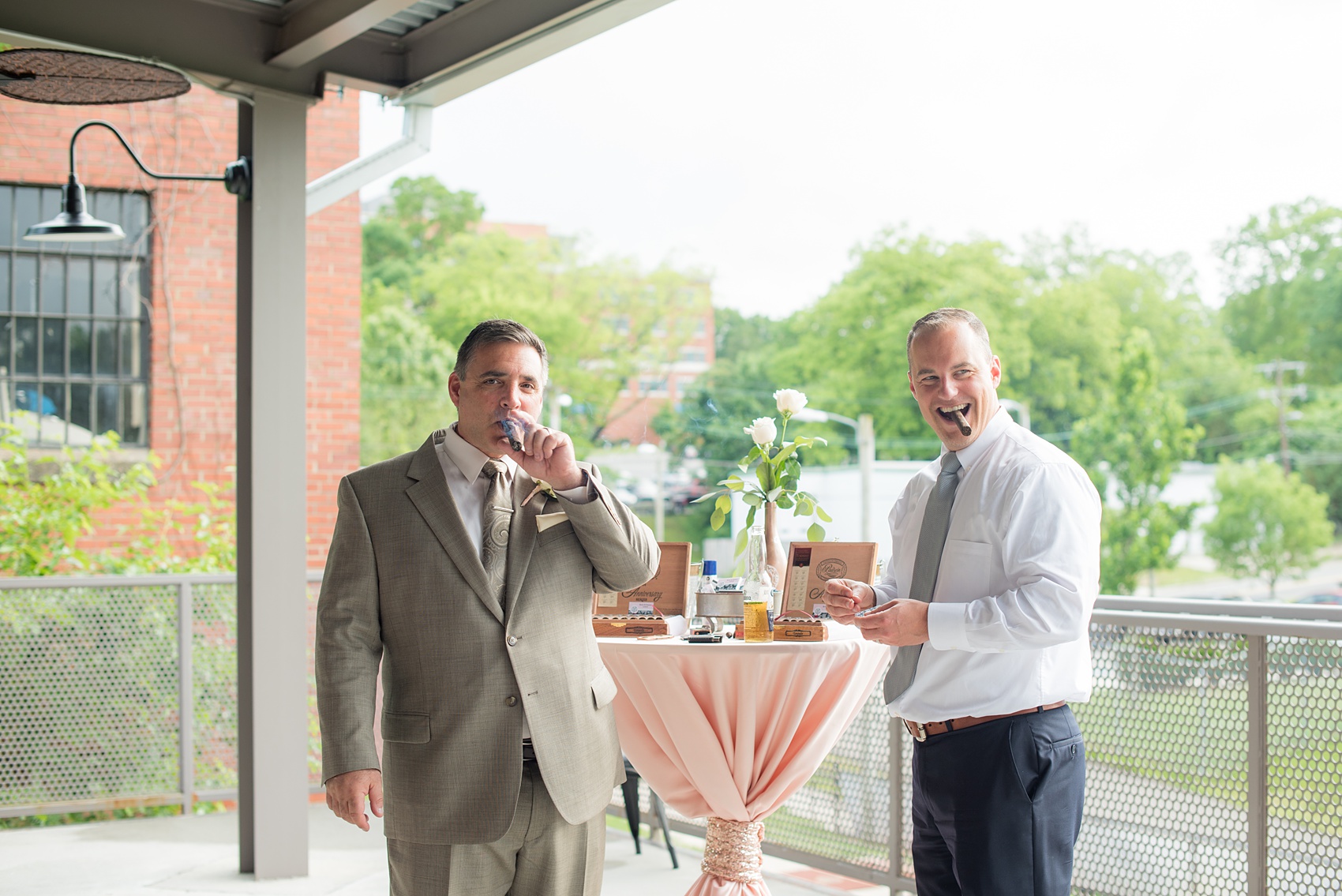 The Rickhouse wedding photos by Mikkel Paige photography in Durham, North Carolina. This urban venue has all the charm of the south for this bride and groom's spring wedding! This picture shows their cigar bar with custom labels and matches. Click through to see more gorgeous details from their day. #mikkelpaige #northcarolina #southernwedding #TheRickhouseDurham #rosegoldandpink #cigarbar