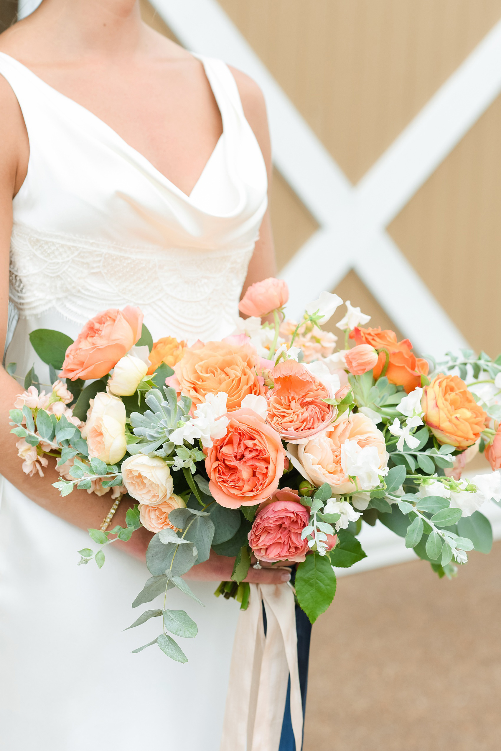 Charlottesville wedding photos by Mikkel Paige Photography. This Virginia venue is perfect for brides and grooms looking for a beautiful farm reception space. It’s green, romantic, and easy to dress up with flowers or keep simple. The bouquets were tied with long navy blue, peach and light pink ribbons and contained colorful flowers like garden roses, peonies, ranunculus and succulents. Click through for the complete post from this May event at the Lodge at Mount Ida Farm! Planning and design by @vivalevent and flowers by @apassarelli of Meristem Floral. #Charlottesville #mountidafarm #lodgeatmountida #CharlottesvilleVA #CharlottesvilleVirginia #Charlottesvillewedding #Charlottesvilleweddingphotographer #mikkelpaige #MeristemFloral #VivaLEvent