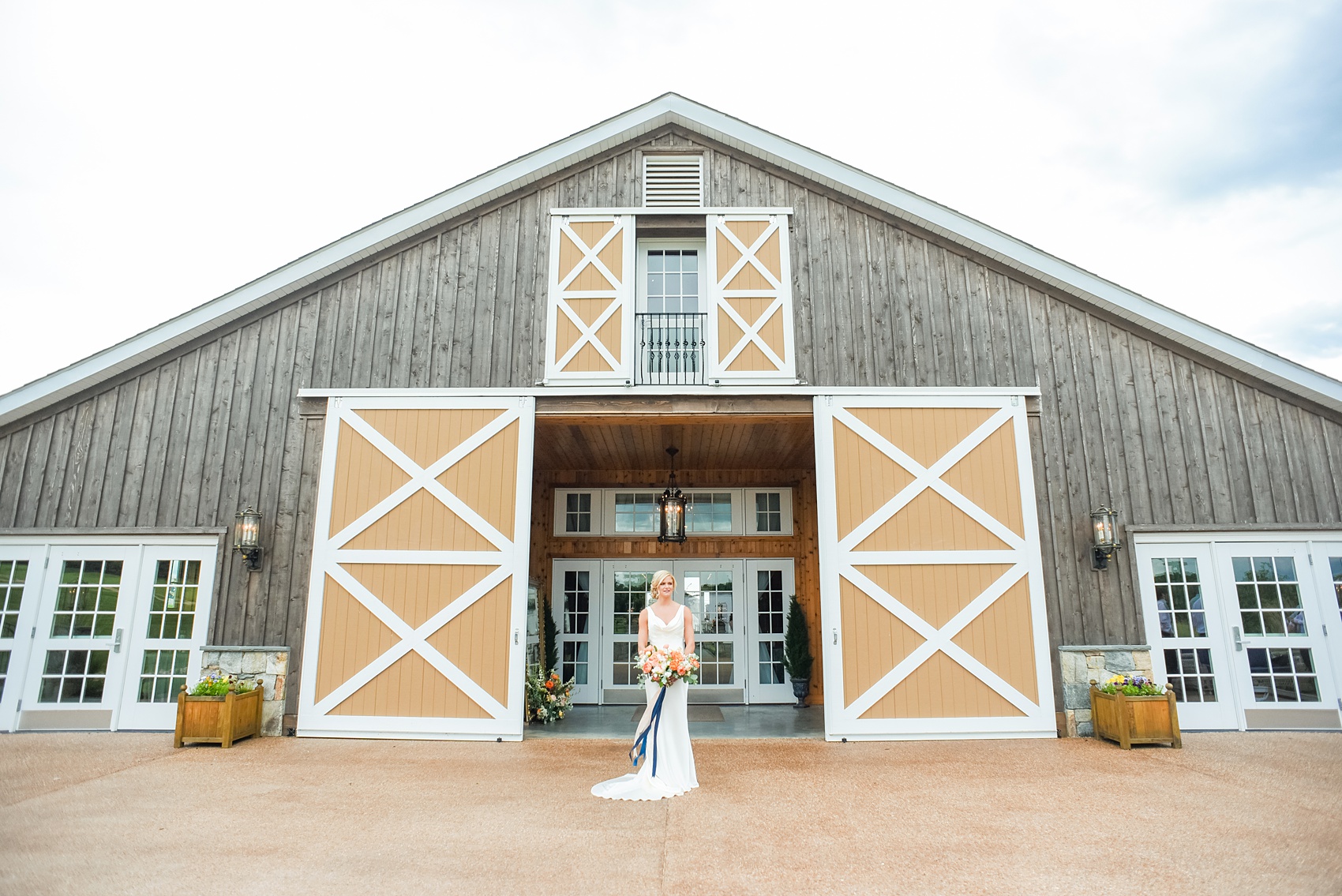 Charlottesville wedding photos by Mikkel Paige Photography. This Virginia venue is perfect for brides and grooms looking for a beautiful farm reception space. The bride wore a sexy, sleek open-back Suzanne Neville gown from Traditions by Anna and carried a bouquet of colorful flowers by Meristem Floral. Her hair was pulled up and makeup done by Wink Hair and Makeup. This green, romantic venue is easy to dress up with flowers or keep simple! Click through for the complete post from this May event at the Lodge at Mount Ida Farm! Planning and design by @vivalevent. #Charlottesville #mountidafarm #lodgeatmountida #CharlottesvilleVA #CharlottesvilleVirginia #Charlottesvillewedding #Charlottesvilleweddingphotographer #mikkelpaige #Vivalevent #herecomesthebride #bridalportraits #bridalphotos 