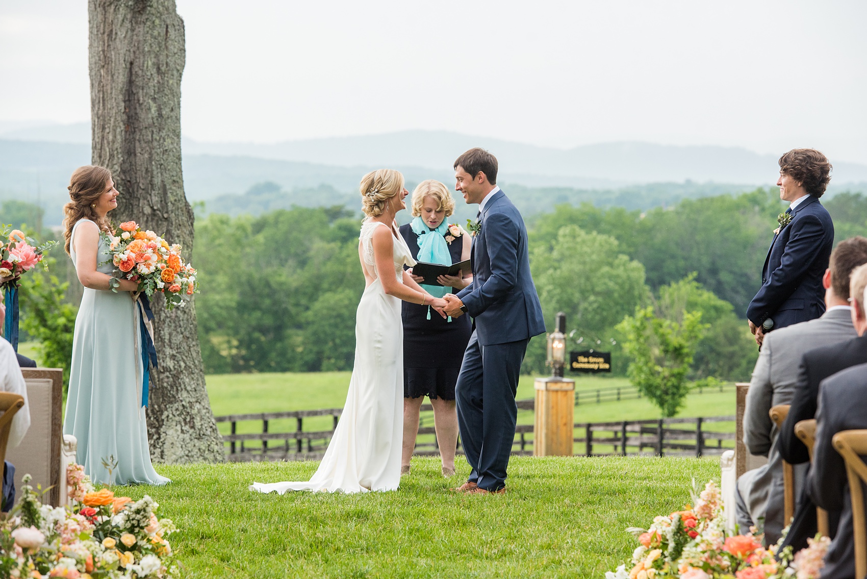 Charlottesville wedding photos by Mikkel Paige Photography at the Lodge at Mount Ida Farm. This Virginia venue is perfect for brides and grooms looking for a beautiful farm reception space. It’s green, romantic, and easy to dress up with flowers or keep simple! The ceremony was held outdoors on the hill, overlooking the Blue Ridge Mountains. Click through for the complete post from this May event, especially details of the flower-lined aisle! Planning and design by @vivalevent and flowers by @apassarelli of Meristem Floral. #Charlottesville #mountidafarm #lodgeatmountida #CharlottesvilleVA #CharlottesvilleVirginia #Charlottesvillewedding #Charlottesvilleweddingphotographer #mikkelpaige #MeristemFloral #VivaLEvent #outdoorceremony #blueridgemountains