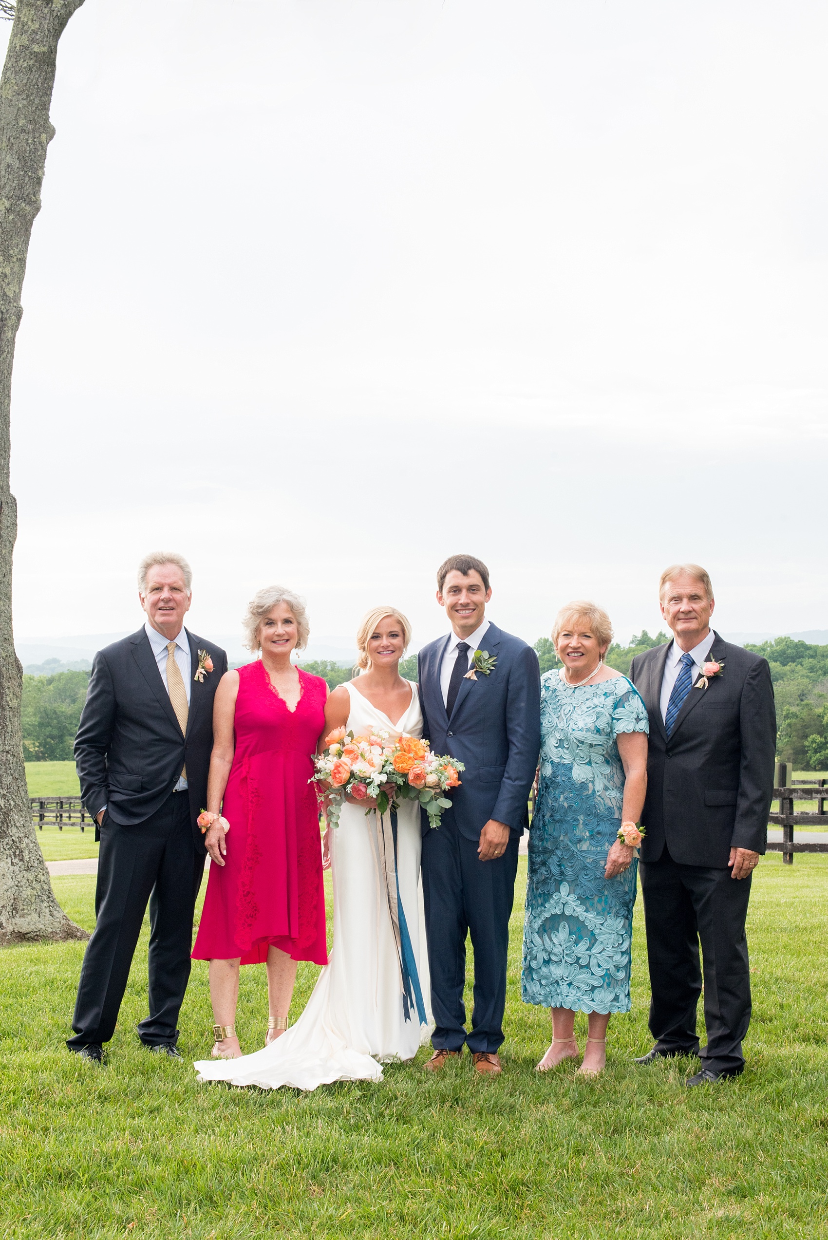 Charlottesville wedding photos by Mikkel Paige Photography at the Lodge at Mount Ida Farm. This Virginia venue is perfect for brides and grooms looking for a beautiful farm reception space. It’s green, romantic, and easy to dress up with flowers or keep simple! The couple took family photos overlooking the Blue Ridge mountain. Click through for the complete post from this May event! Planning by @vivalevent and flowers by @apassarelli of Meristem Floral. #Charlottesville #mountidafarm #lodgeatmountida #CharlottesvilleVA #CharlottesvilleVirginia #Charlottesvillewedding #Charlottesvilleweddingphotographer #mikkelpaige #MeristemFloral #VivaLEvent #BlueRidgeMountains 