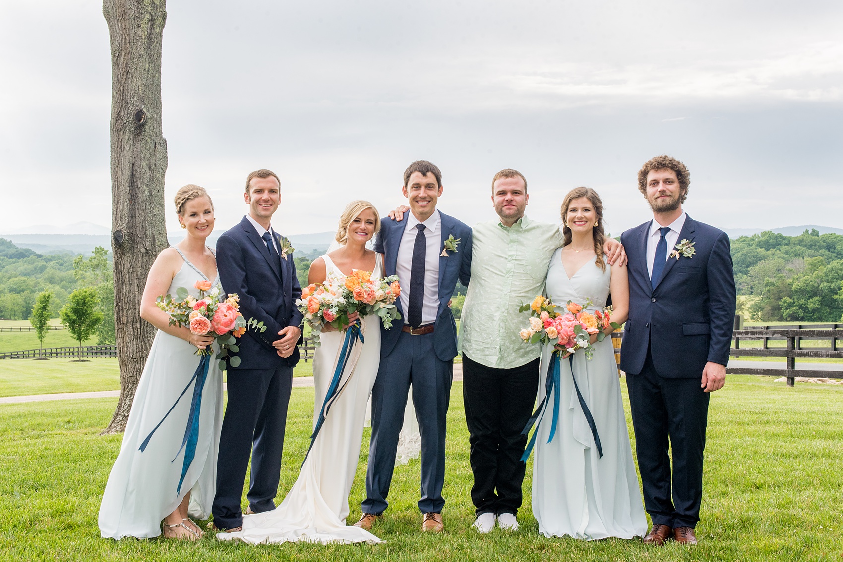 Charlottesville wedding photos by Mikkel Paige Photography at the Lodge at Mount Ida Farm. This Virginia venue is perfect for brides and grooms looking for a beautiful farm reception space. It’s green, romantic, and easy to dress up with flowers or keep simple! The wedding party looked elegant with the groomsmen in navy blue suits, succulent boutonnieres, and bridesmaids wore mismatched mint green gowns with colorful bouquets. Click through for the complete post from this May event! Planning by @vivalevent and flowers by @apassarelli of Meristem Floral. #Charlottesville #mountidafarm #lodgeatmountida #CharlottesvilleVA #CharlottesvilleVirginia #Charlottesvillewedding #Charlottesvilleweddingphotographer #mikkelpaige #MeristemFloral #VivaLEvent