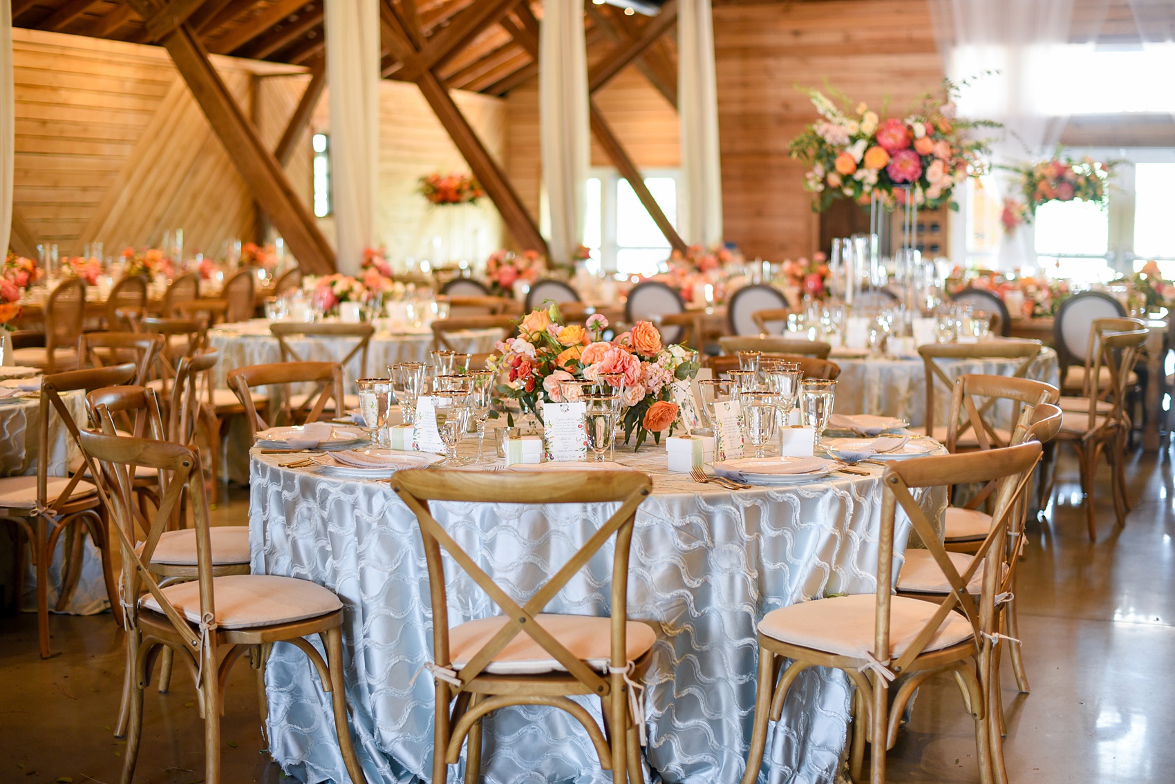 Charlottesville wedding photos by Mikkel Paige Photography. This Virginia venue is perfect for brides and grooms looking for a beautiful farm reception space. It’s green, romantic, and easy to dress up with flowers or keep simple. A rustic and elegant came to life at the reception barn with chandeliers, fabric draping, mixed rectangular farm tables and round luxurious linen-covered round tables inside the venue. Tall and short centerpieces with colorful flowers like garden roses, peonies, ranunculus and succulents completed the tables. Click through for the complete post from this May event at the Lodge at Mount Ida Farm! Planning and design by @vivalevent and flowers by @apassarelli of Meristem Floral. #Charlottesville #mountidafarm #lodgeatmountida #CharlottesvilleVA #CharlottesvilleVirginia #Charlottesvillewedding #Charlottesvilleweddingphotographer #mikkelpaige #MeristemFloral #VivaLEvent