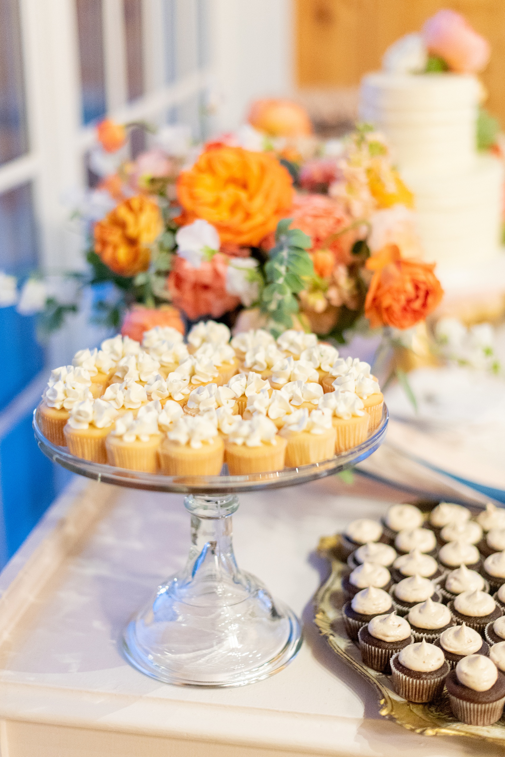 Charlottesville wedding photos by Mikkel Paige Photography. This Virginia venue is perfect for brides and grooms looking for a beautiful farm reception space. It’s green, romantic, and easy to dress up with flowers or keep simple. The dessert table had mini cupcakes, sugar cookies and a simple white buttercream cake decorated with fresh flowers for their sweets. Click through for the complete post from this May event at the Lodge at Mount Ida Farm! Planning and design by Viva L’Event. #Charlottesville #mountidafarm #lodgeatmountida #CharlottesvilleVA #CharlottesvilleVirginia #Charlottesvillewedding #meristemfloral #Charlottesvilleweddingphotographer #mikkelpaige #desserttable #rusticdesserttable #passionflowercakes