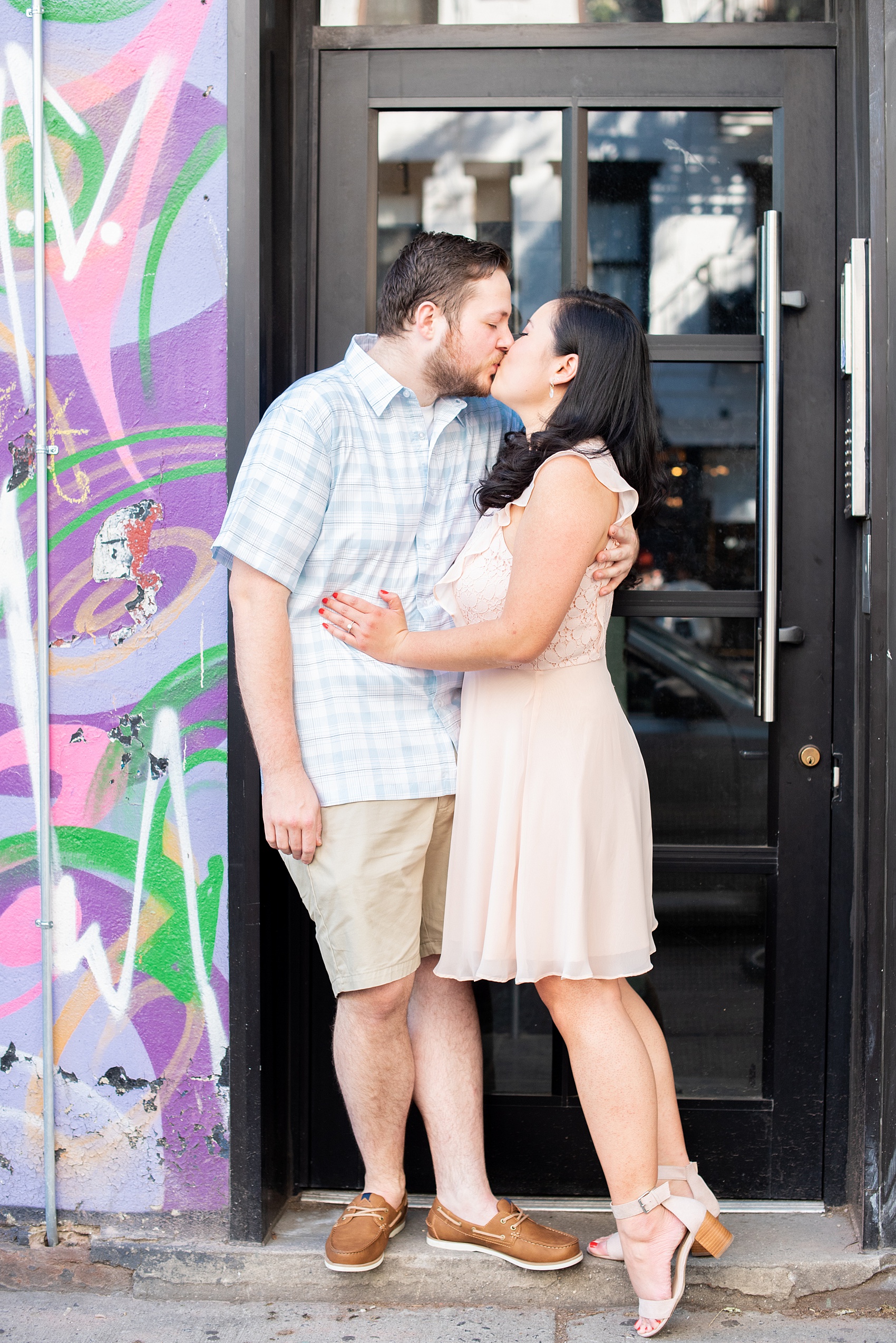 Lower East Side engagement photos and colorful ideas for a shoot in Manhattan by Mikkel Paige Photography. These creative pictures with an interracial couple in an urban environment in downtown NYC will have you wanting to see more...be sure to click through to see the entire shoot! #mikkelpaige #EngagementPhotos #engagementshoot #EngagementPictures 