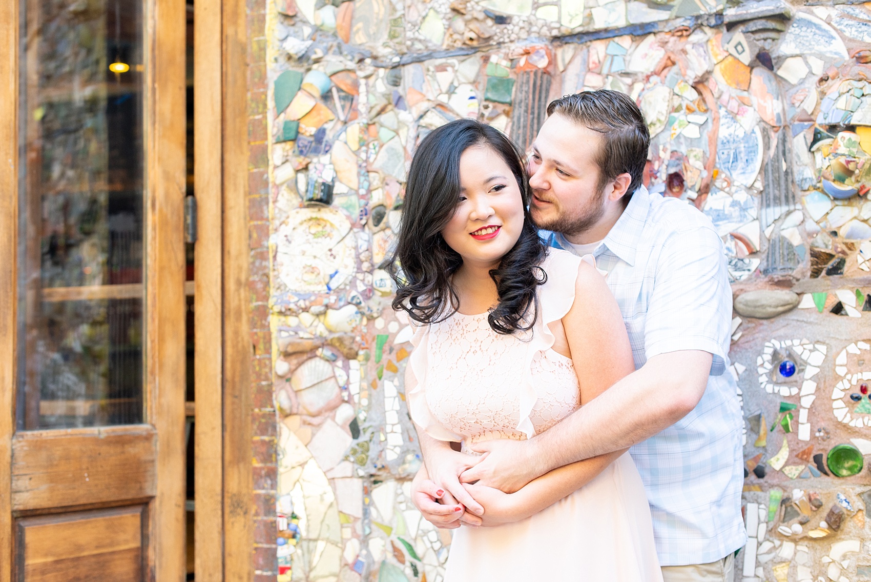 Lower East Side engagement photos and colorful ideas for a shoot in Manhattan by Mikkel Paige Photography. These creative pictures with an interracial couple in an urban environment in downtown NYC will have you wanting to see more than just this cool mosaic wall...be sure to click through to see the entire shoot! #mikkelpaige #EngagementPhotos #engagementshoot #EngagementPictures