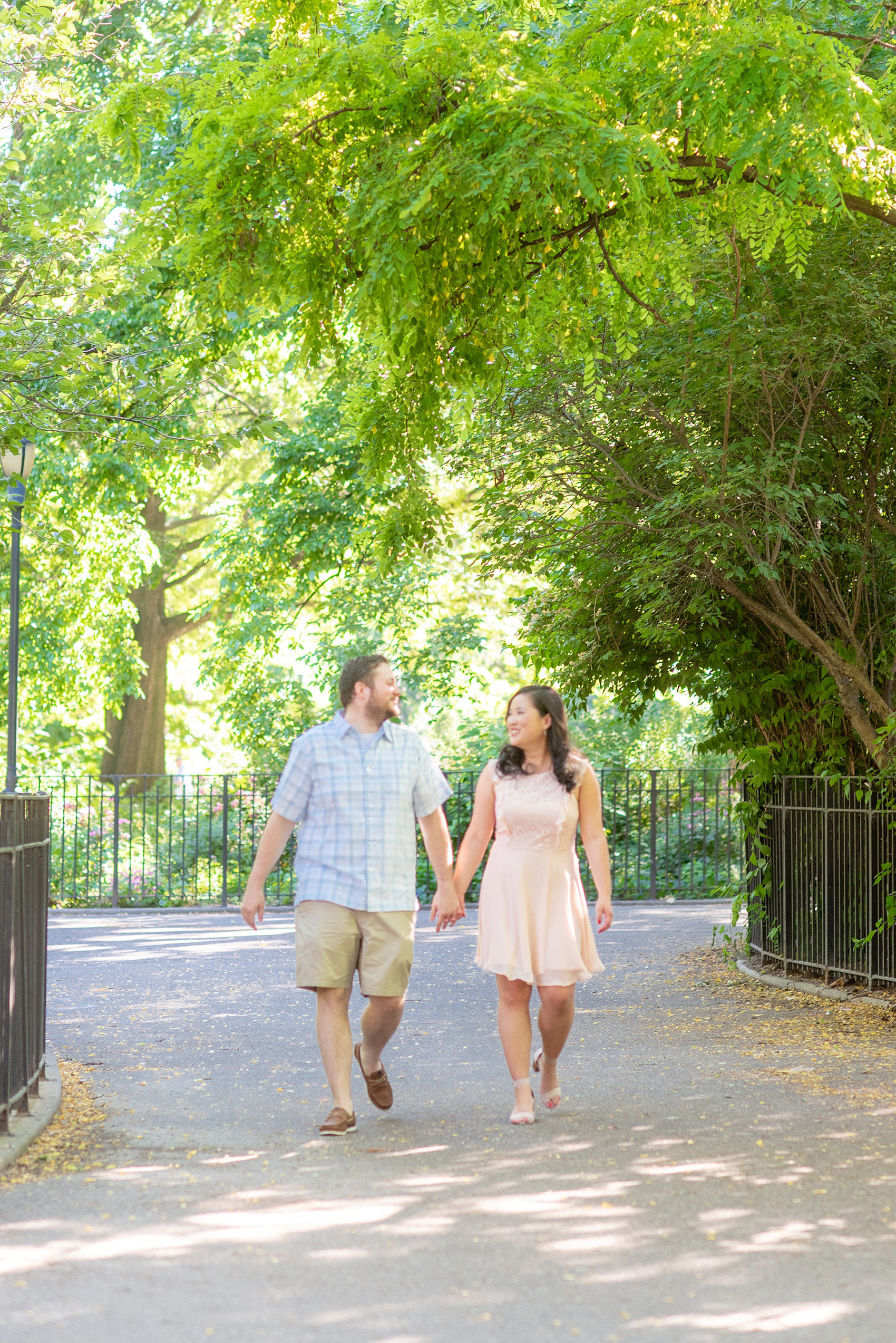 Engagement photos and colorful ideas for a shoot in the Lower East Side by Mikkel Paige Photography. These creative pictures with an interracial couple (and the beauty of the park!) in an urban environment in downtown NYC will have you wanting to see more...be sure to click through to see the entire shoot! #mikkelpaige #EngagementPhotos #engagementshoot #EngagementPictures