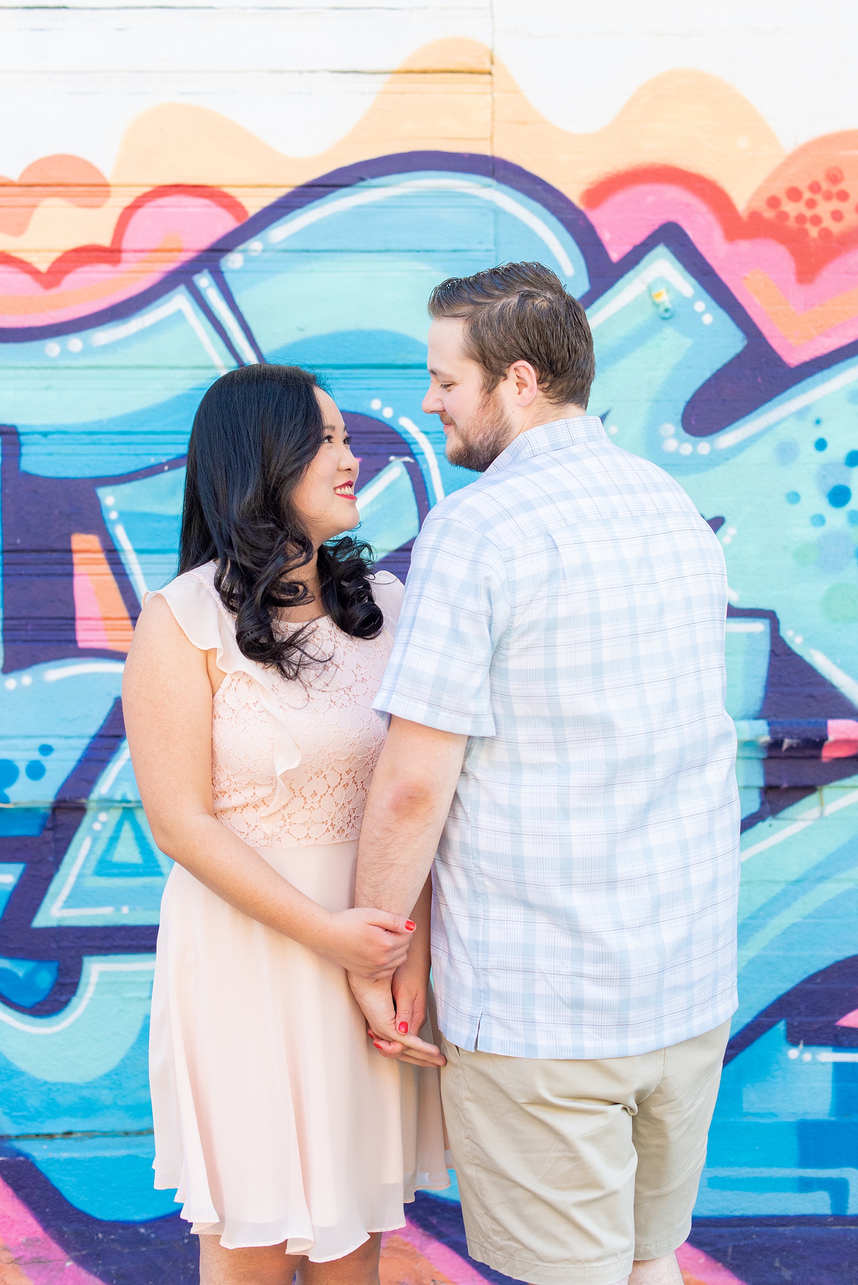 Engagement photos and colorful ideas for a shoot in the Lower East Side by Mikkel Paige Photography. These creative pictures with an interracial couple in an urban environment in downtown NYC will have you wanting to see more...so be sure to click through to see the entire shoot! #mikkelpaige #EngagementPhotos #engagementshoot #EngagementPictures