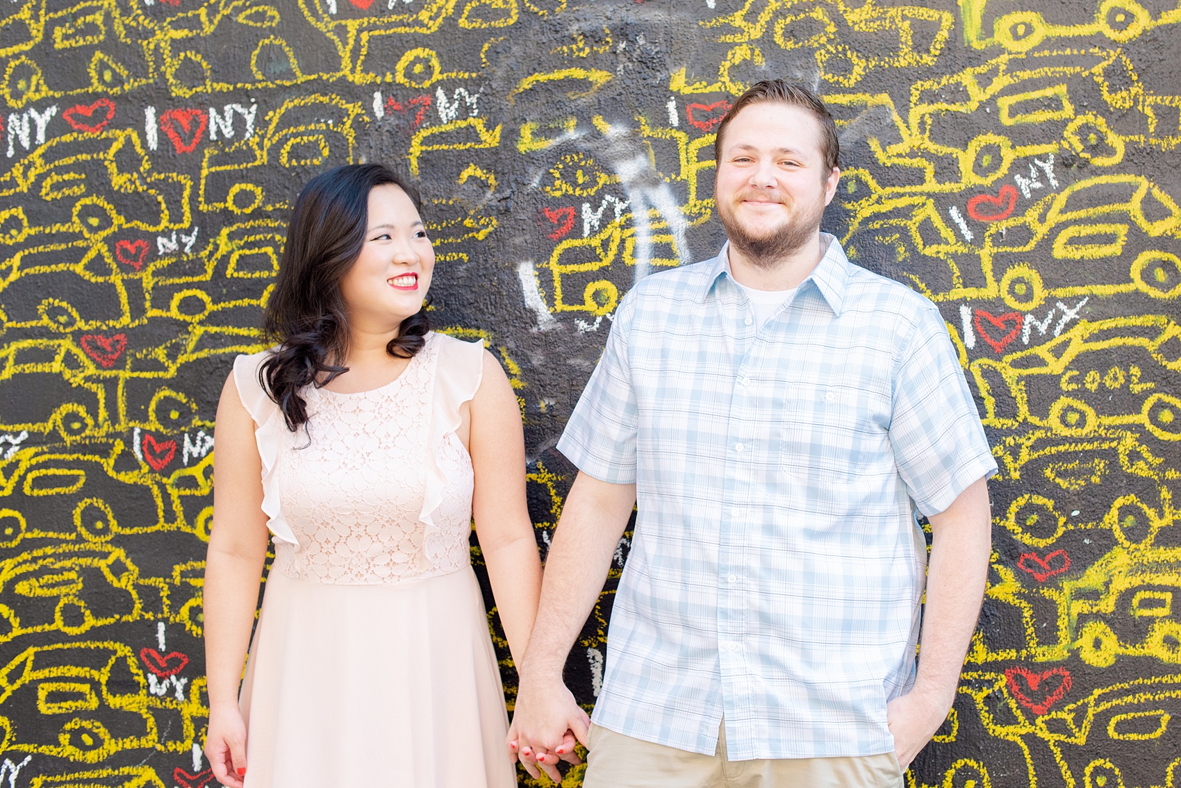 Engagement photos and colorful ideas for a shoot in the Lower East Side by Mikkel Paige Photography. These creative pictures with an interracial couple in an urban environment in downtown NYC will have you wanting to see more...so be sure to click through to see the entire shoot! #mikkelpaige #EngagementPhotos #engagementshoot #EngagementPictures