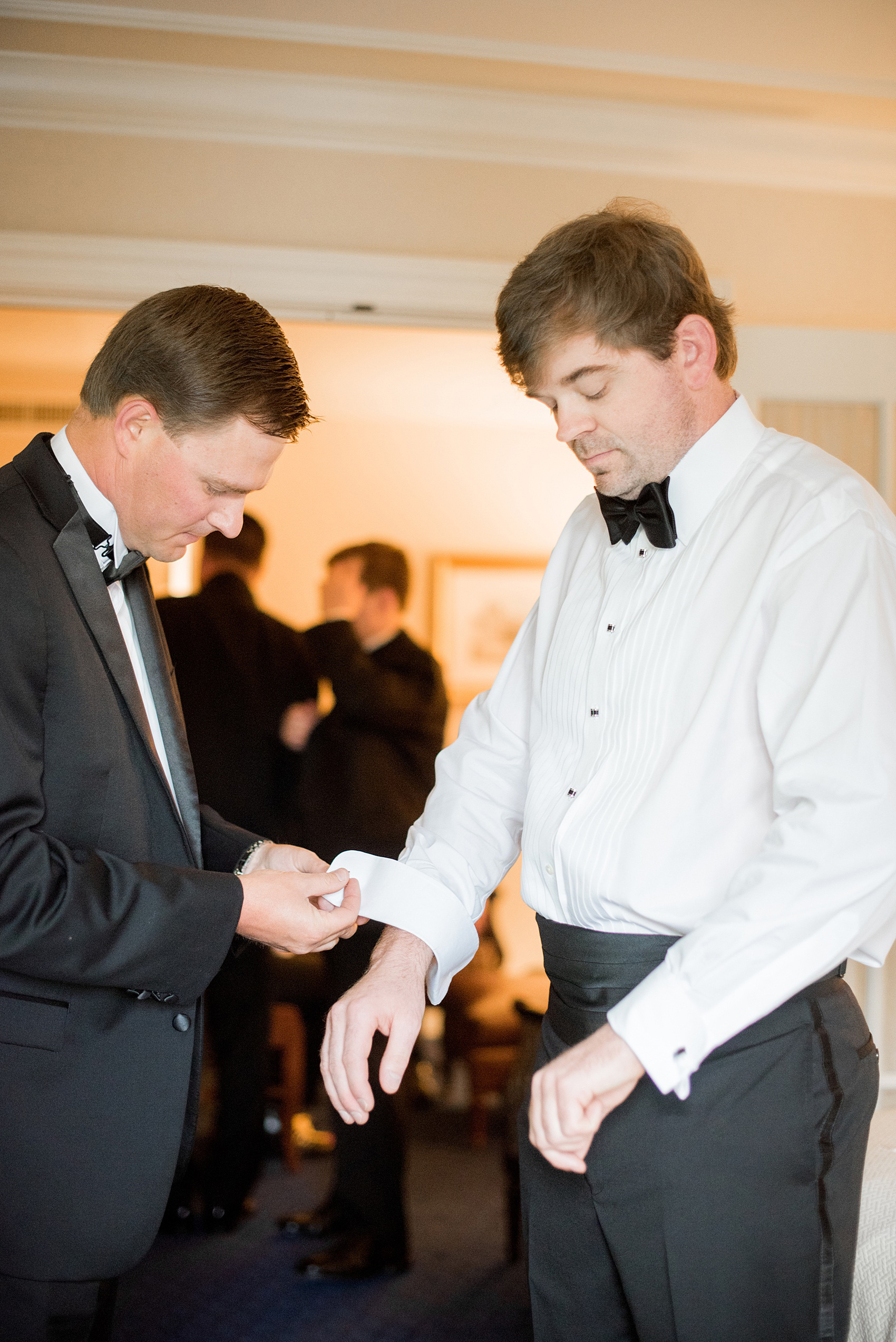 Mikkel Paige Photography pictures of a venue in Durham, North Carolina. The Washington Duke Inn is perfect for a summer wedding! Planning for this beautiful event was by McLean Events. The groom purchased special silver and black enamel cufflinks for the day his Best Man helped him put on. Click through for more details about this June wedding with peonies! #MikkelPaige #DurhamWeddings #WashingtonDukeInn #DukeWedding #Duke #McLeanEvents #blueandwhitewedding #groom #cufflinks #bestman