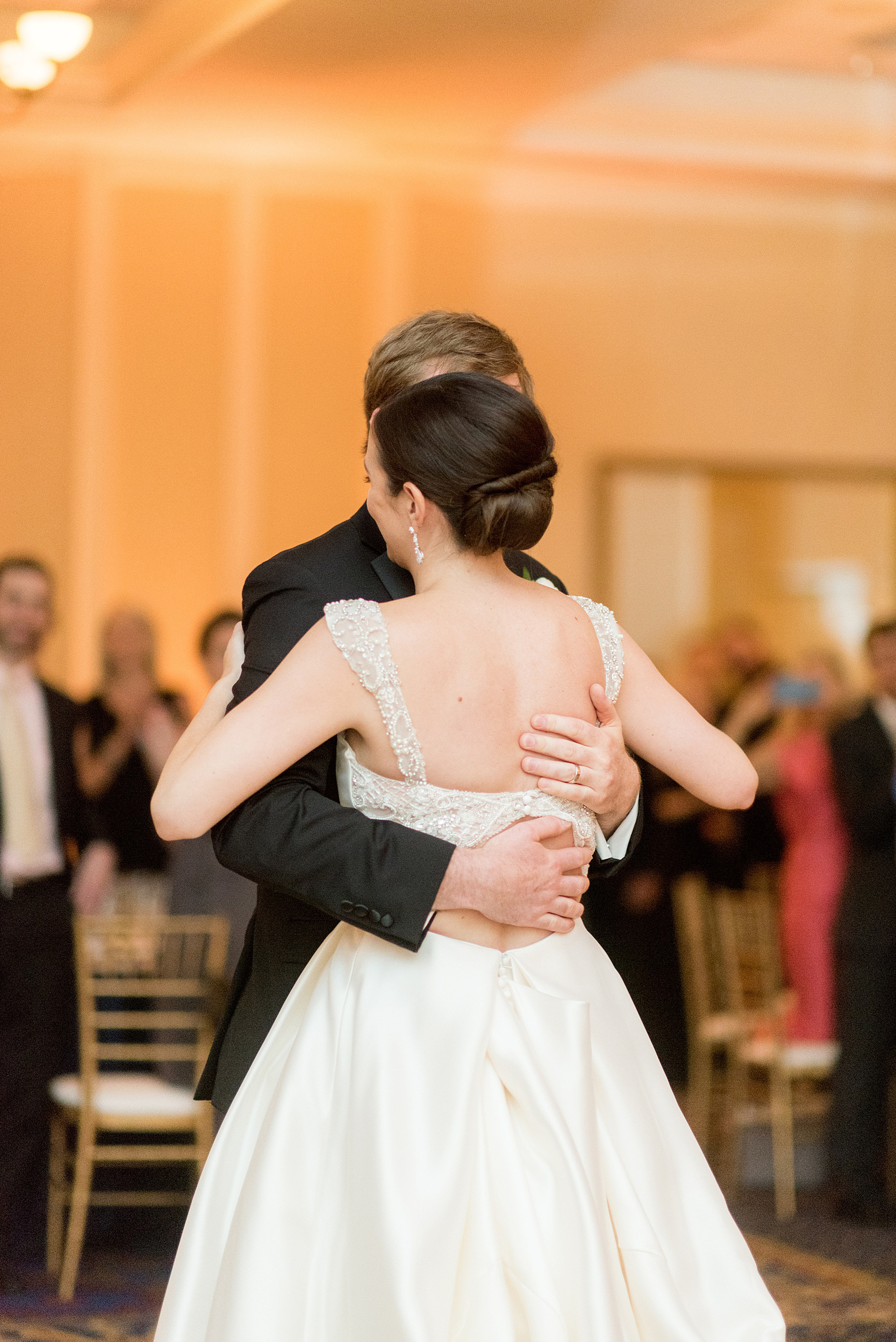 Mikkel Paige Photography pictures of a venue in Durham, North Carolina. The Washington Duke Inn is perfect for a summer wedding! Planning for this beautiful event was by McLean Events. The bride and groom danced their first dance to Ray LaMontagne's, "You Are the Best Thing." Click through for more details about this June wedding with peonies! #MikkelPaige #DurhamWeddings #WashingtonDukeInn #DukeWedding #Duke #McLeanEvents #blueandwhitewedding #golfcoursewedding #bluereception #indoorreception #firstdance #youarethebestthing #raylamontagne