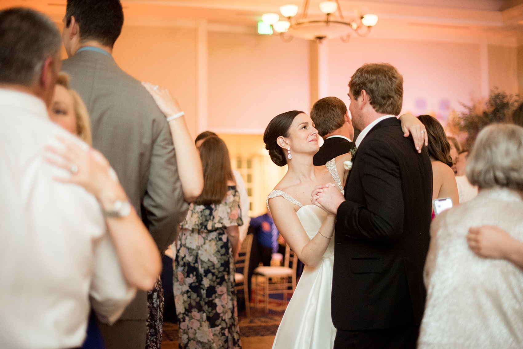 Mikkel Paige Photography pictures of a venue in Durham, North Carolina. The Washington Duke Inn is perfect for a summer wedding! Planning for this beautiful event was by McLean Events. The guests danced the night away on the dance floor to a live band. Click through for more details about this June wedding with peonies! #MikkelPaige #DurhamWeddings #WashingtonDukeInn #DukeWedding #Duke #McLeanEvents #blueandwhitewedding #golfcoursewedding #bluereception #indoorreception #receptiondancing #dancefloor