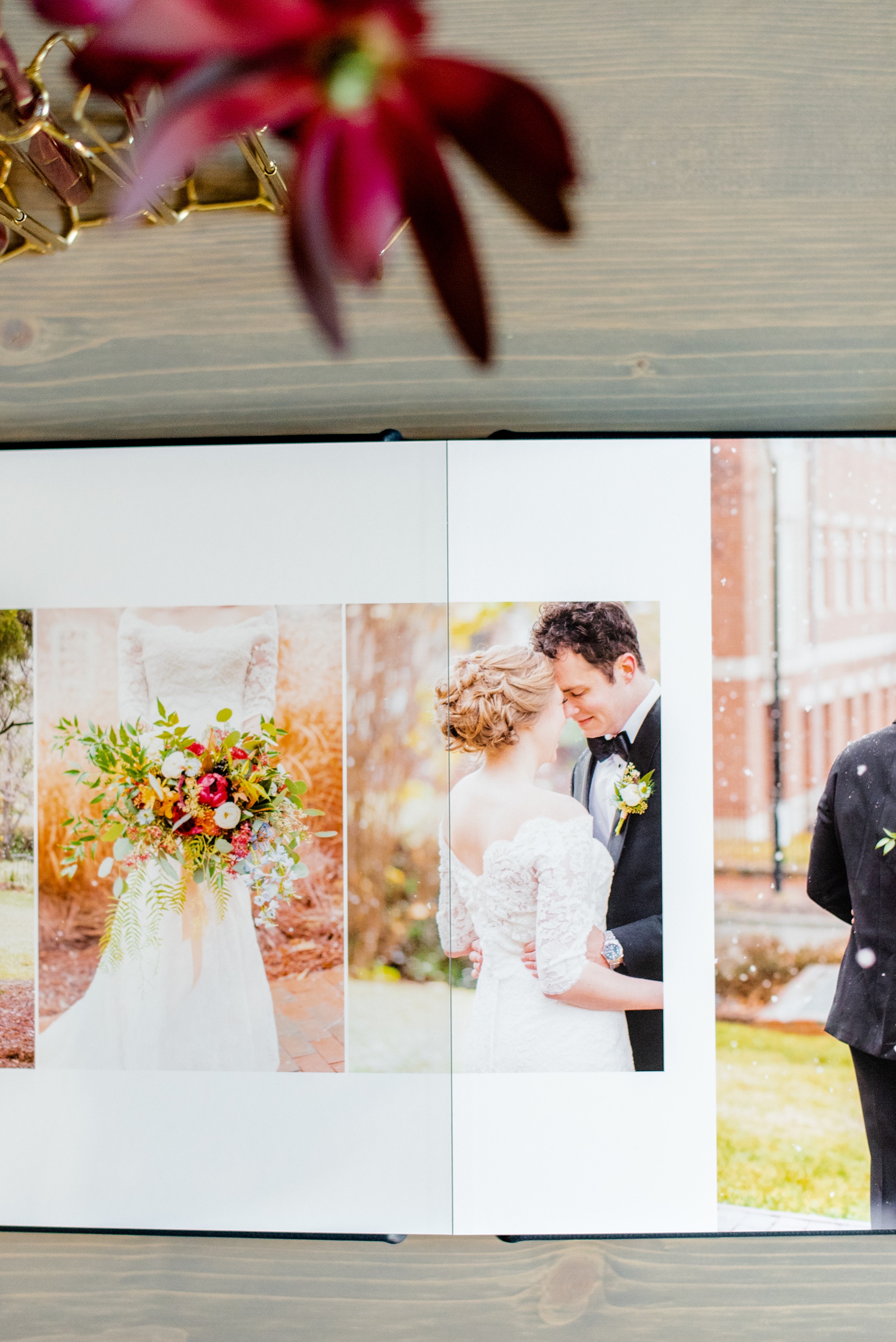 Navy blue leather fine art wedding album from Mikkel Paige Photography, with photos from a snowy winter wedding at The Carolina Inn, in North Carolina. This beatiful, historic venue in Chapel Hill is perfect for outdoor and indoor events no matter if it's spring, summer or fall too. Click through to see more pictures of this couples gorgeous family heirloom keepsakes! #mikkelpaige #carolinainnweddingphotos #carolinainn #leatheralbum #weddingalbum #chapelhill