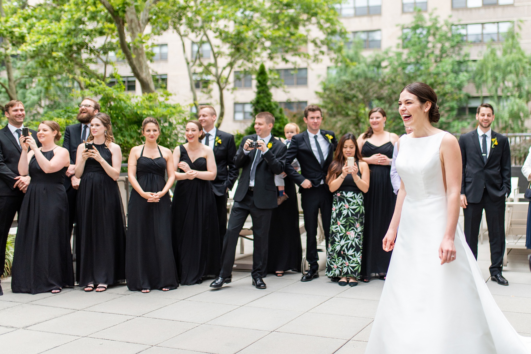 Manhattan Central Park wedding photos by Mikkel Paige Photography at Loeb Boathouse venue. These summer ceremony and reception pictures show a timeless couple having fun at their colorful day with guests who traveled in from abroad. The bride and groom did their first look on the Upper West Side...click through for the complete post! #CentralParkWeddingVenues #NYCweddingphotographer #NYCwedding