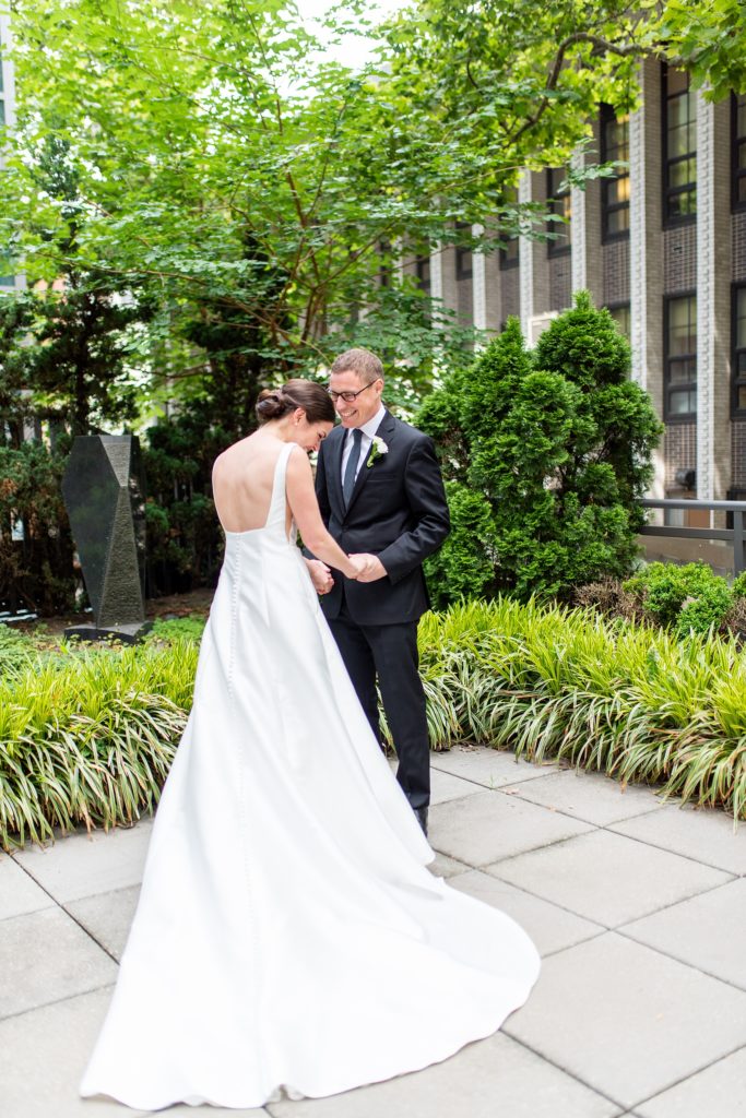 Manhattan Central Park wedding photos by Mikkel Paige Photography at Loeb Boathouse venue. These summer ceremony and reception pictures show a timeless couple having fun at their colorful day with guests who traveled in from abroad. The bride and groom did their emotional first look on the Upper West Side...click through for the complete post! #CentralParkWeddingVenues #NYCweddingphotographer #NYCwedding #firstlook