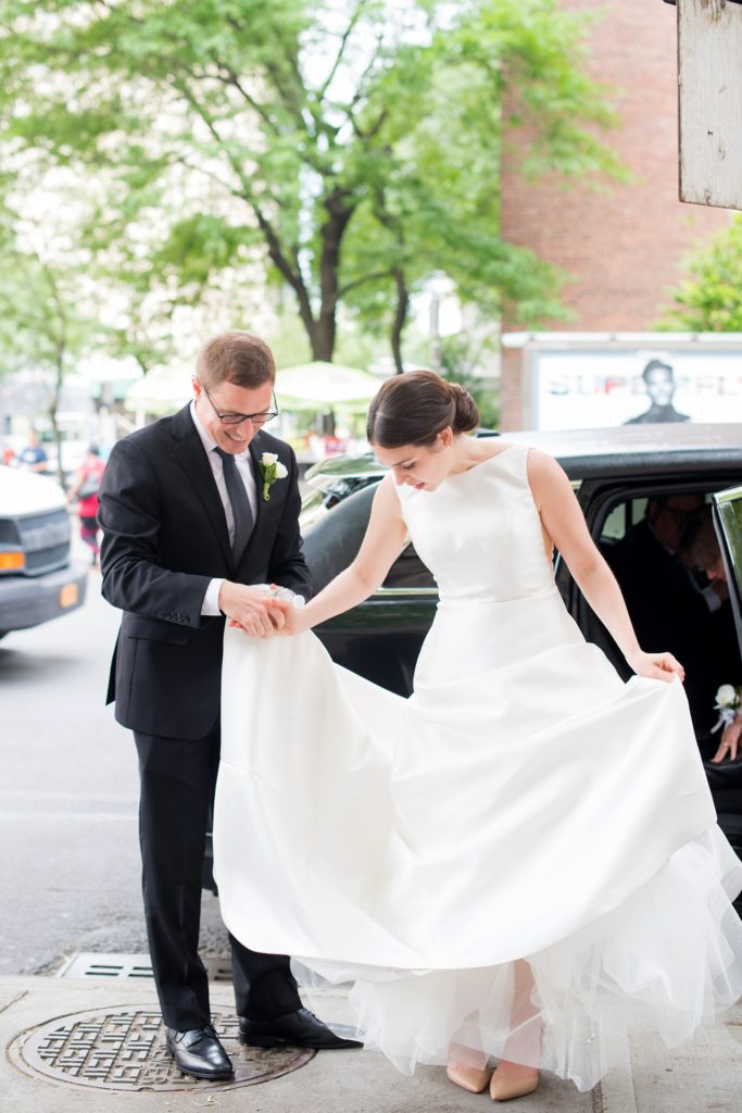 Manhattan Central Park wedding photos by Mikkel Paige Photography at Loeb Boathouse venue. The groom helped his bride out of the limo for their church ceremony on the Upper West Side. Click through for the complete post including their ceremony, reception and details! #CentralParkWeddingVenues #NYCwedding #SummerWedding #CentralParkPhotos #NYbrideandgroom #churchceremony #summerwedding #NYCweddingphotographer