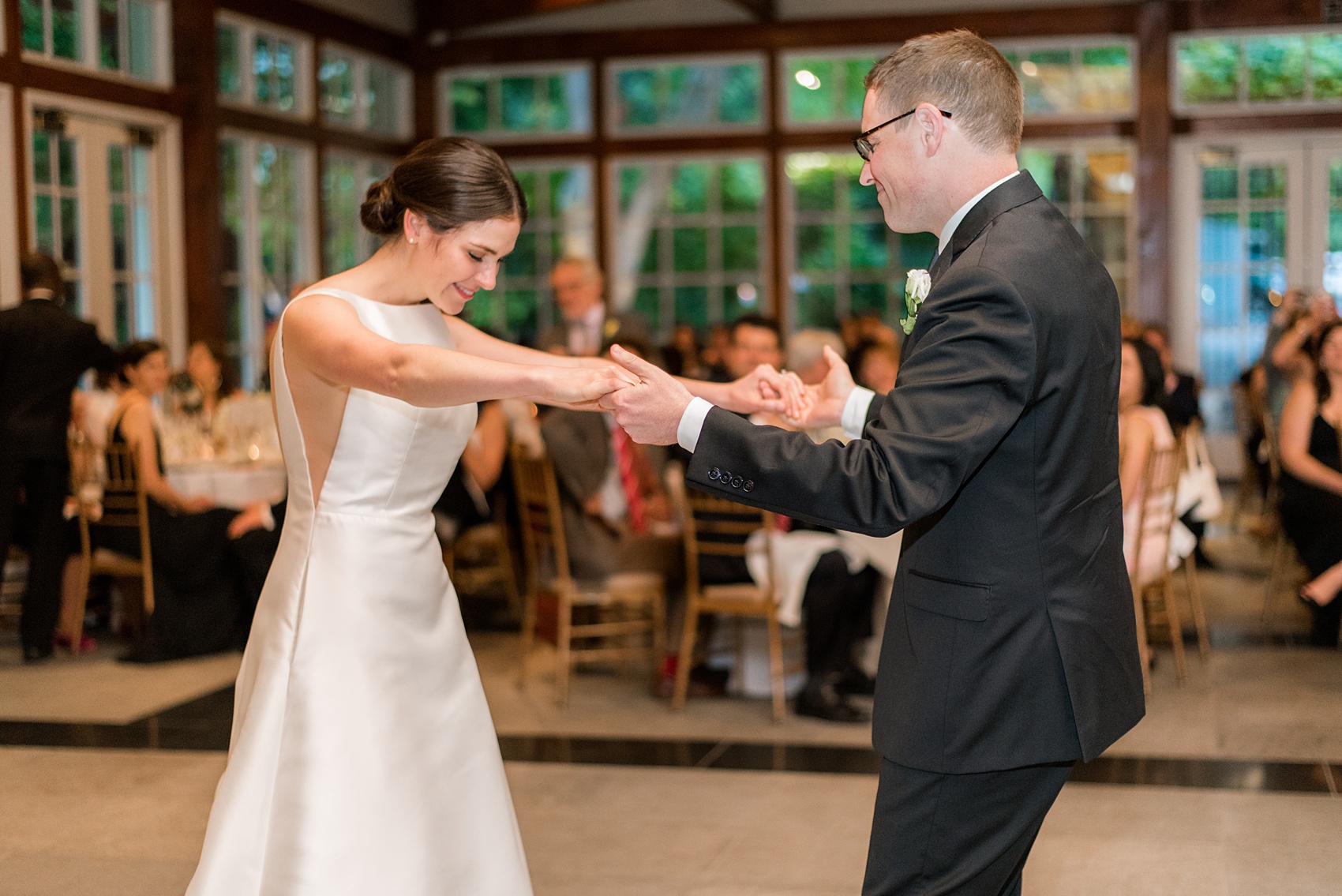 Manhattan Central Park wedding photos by Mikkel Paige Photography at Loeb Boathouse venue. The reception was by the lake and Bethesda Terrace for a June celebration. Guests, who traveled in from near and far, danced the night away inside the venue, with the bride and groom doing their first dance to Frank Sinatra's "Fly Me to the Moon". Click through for the complete post! #CentralParkWeddingVenues #NYCwedding #SummerWedding #brideandgroom #firstdance #firstdancesong