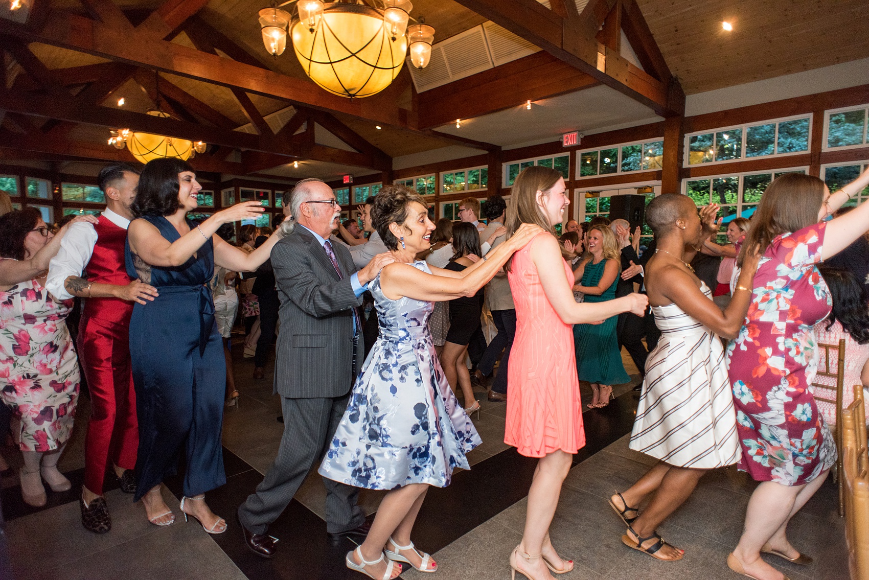 Manhattan Central Park wedding photos by Mikkel Paige Photography at Loeb Boathouse venue. The reception was by the lake and Bethesda Terrace for a June celebration. Guests, who traveled in from near and far, danced the night away inside the venue, with a conga line to "Jump in the Line" better known as "Shake Senora," by Harry Belafonte. Click through for the complete post! #CentralParkWeddingVenues #NYCwedding #SummerWedding #dancesongs #weddingDJ #weddingDJlist #ShakeSenora #HarryBelafonte