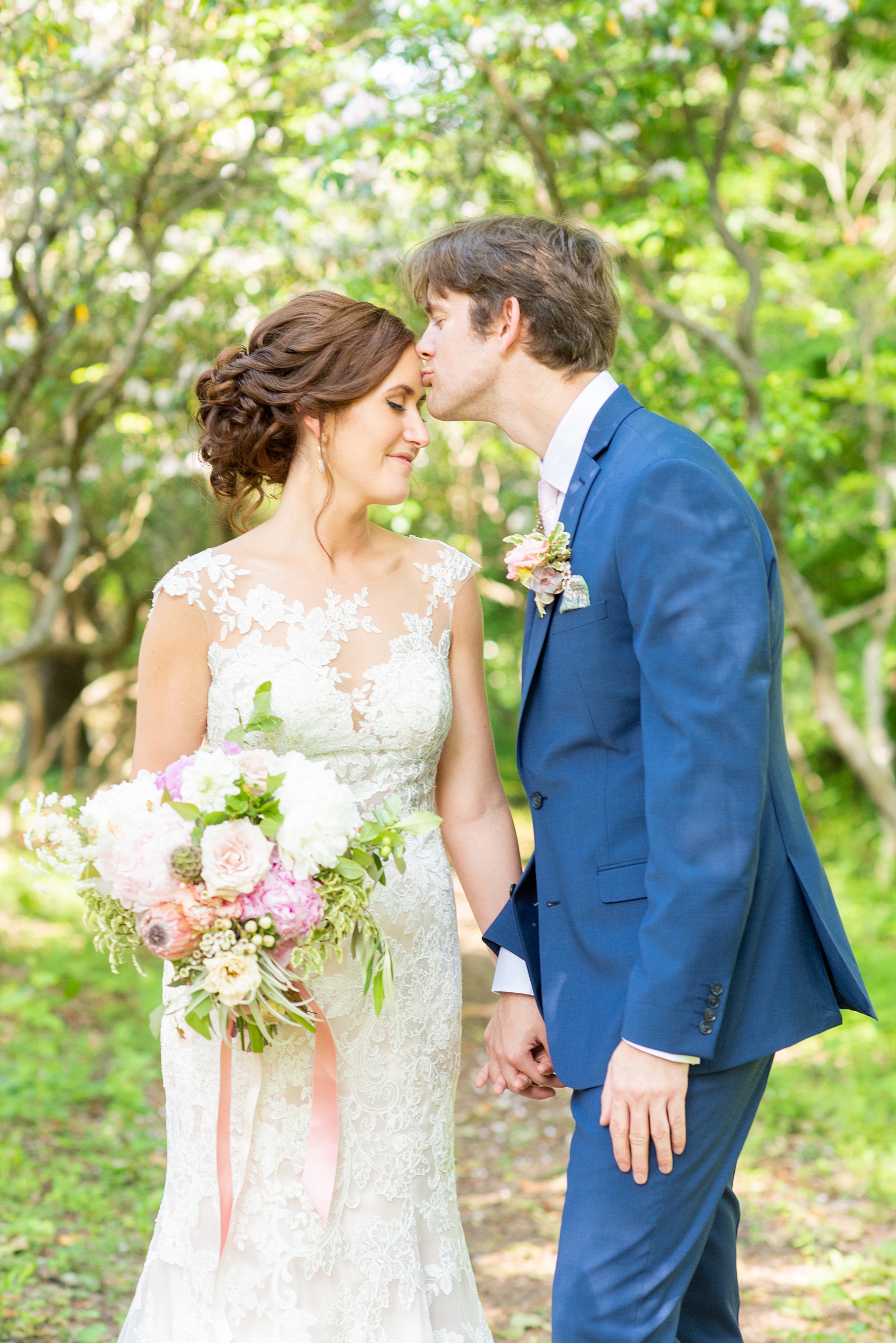 A summer wedding at Olde Mill Inn, NJ. Photos by Mikkel Paige Photography for an event with pink and blue details. The bride and groom chose to have their photos taken at Cross Estate Gardens, just down the road from this New Jersey Venue. Click through for their complete wedding recap! #OldeMillInn #NJwedding #NJweddingphotographer #mikkelpaige #NewJerseyWeddingVenue #NewJerseyWedding #CrossEstateGardens #brideandgroom