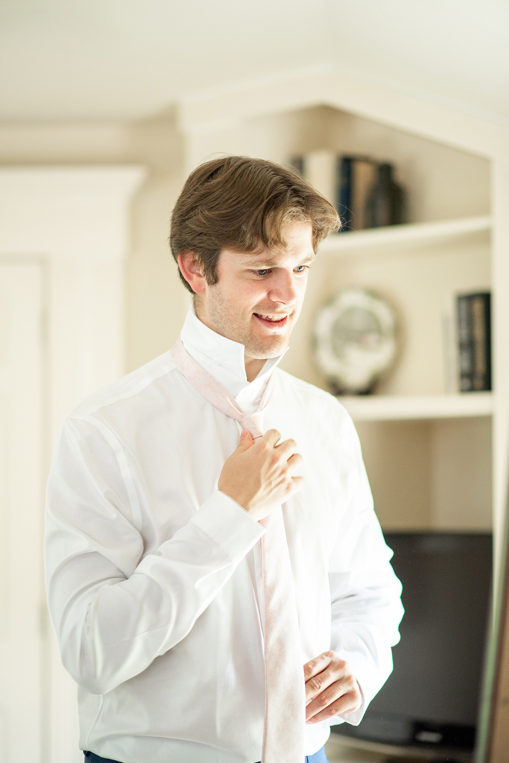 A summer wedding at Olde Mill Inn, NJ. Photos by Mikkel Paige Photography for an event with pink and blue details. This New Jersey venue is a great option for something not too far from NYC. The couple prepared with getting ready pictures at the inn and the groom wore a light pink tie. Click through for their complete wedding recap! #OldeMillInn #NJwedding #NJweddingphotographer #mikkelpaige #NewJerseyWeddingVenue #NewJerseyWedding #CrossEstateGardens #groom #gettingready