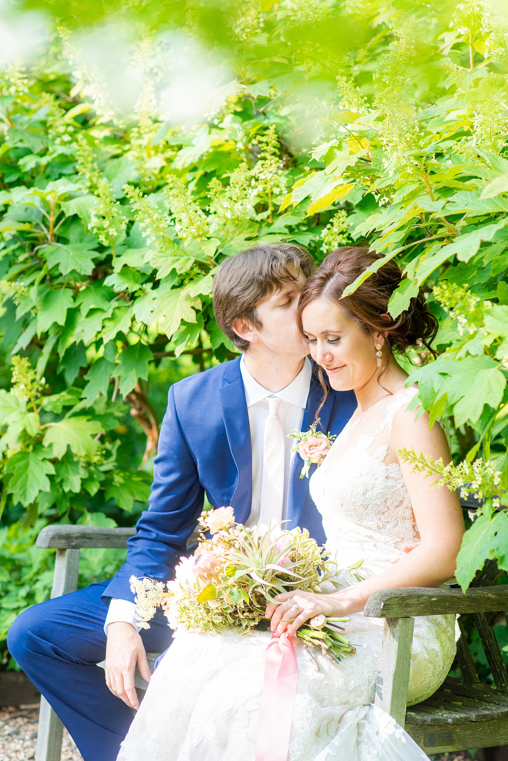 A summer wedding at Olde Mill Inn, NJ. Photos by Mikkel Paige Photography for an event with pink and blue details. The bride and groom chose to have their photos taken at Cross Estate Gardens, just down the road from this New Jersey Venue. Click through for their complete wedding recap! #OldeMillInn #NJwedding #NJweddingphotographer #mikkelpaige #NewJerseyWeddingVenue #NewJerseyWedding #CrossEstateGardens #brideandgroom 