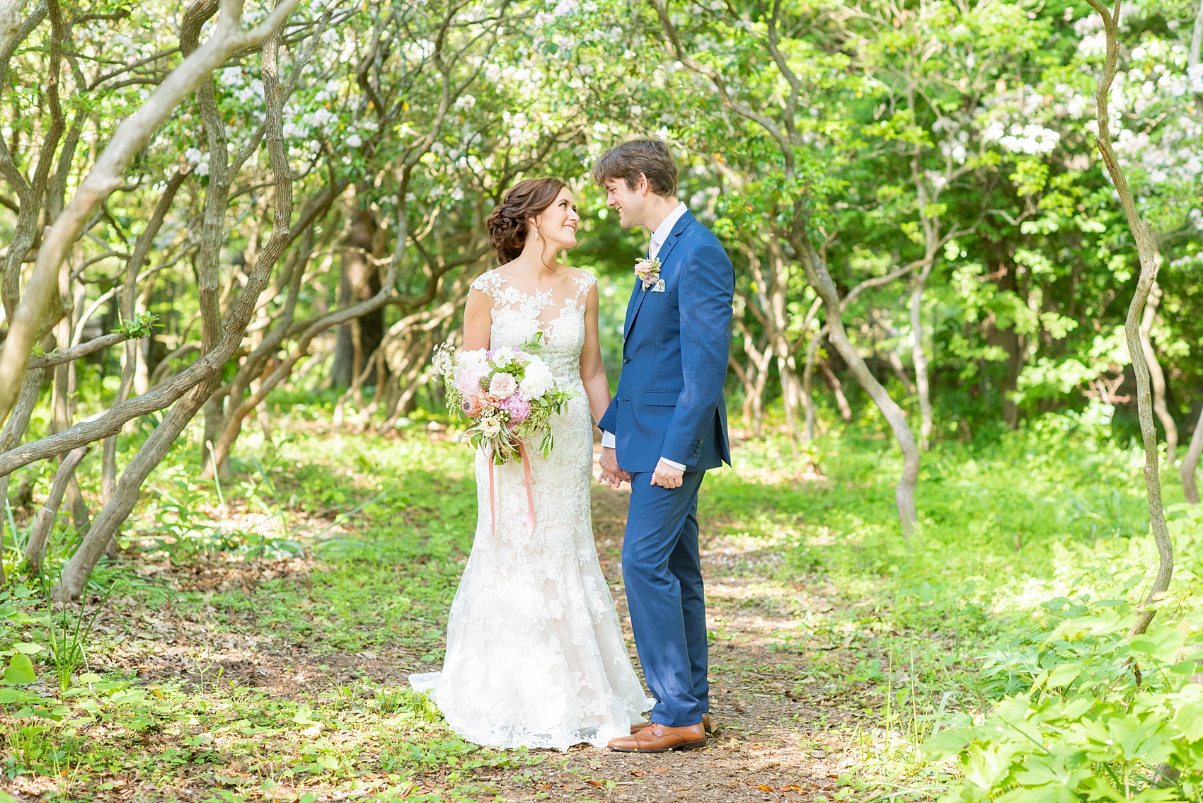 A summer wedding at Olde Mill Inn, NJ. Photos by Mikkel Paige Photography for an event with pink and blue details. The bride and groom chose to have their photos taken at Cross Estate Gardens, just down the road from this New Jersey Venue. Click through for their complete wedding recap! #OldeMillInn #NJwedding #NJweddingphotographer #mikkelpaige #NewJerseyWeddingVenue #NewJerseyWedding #CrossEstateGardens #brideandgroom 