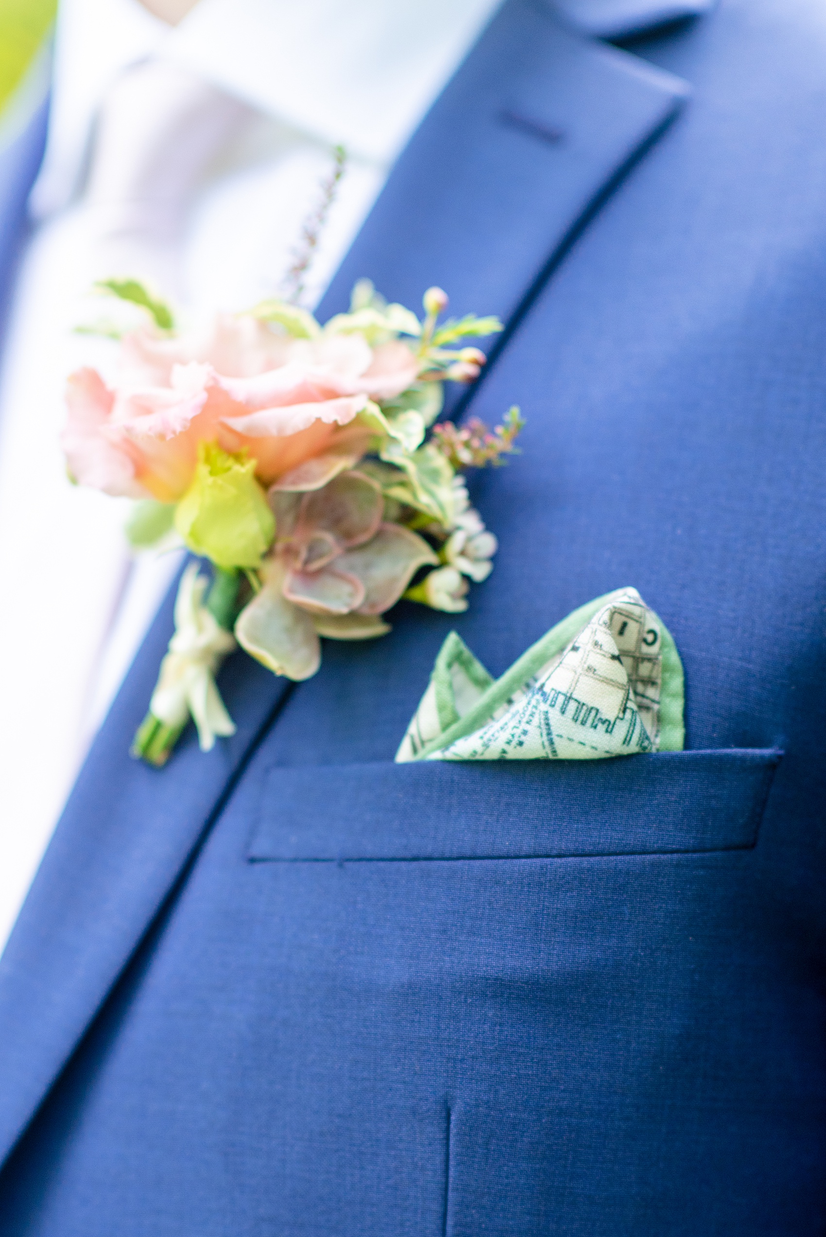 A summer wedding at Olde Mill Inn, NJ. Photos by Mikkel Paige Photography for an event with light pink and blue details. The groom wore a blue suit for his New Jersey venue event. A NYC pattern pocket square, highlighting Jersey City where the bride and groom live, finished the look with a white satin tie. Click through for their complete wedding recap! #OldeMillInn #NJwedding #NJweddingphotographer #mikkelpaige #NewJerseyWeddingVenue #NewJerseyWedding #CrossEstateGardens #groom #groomsuits #bluesuit #groomdetails