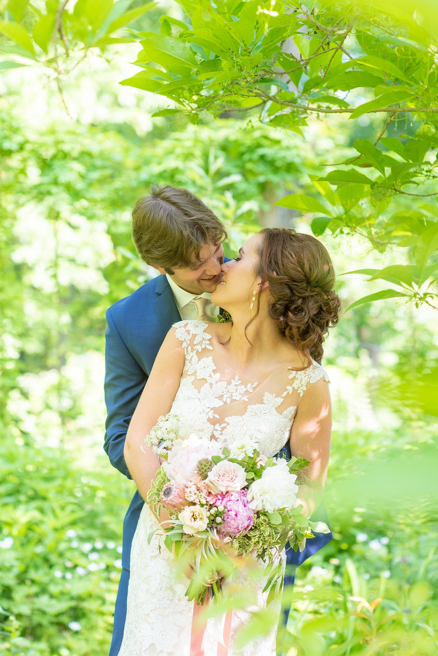 A summer wedding at Olde Mill Inn, NJ. Photos by Mikkel Paige Photography for an event with pink and blue details. The bride and groom chose to have their photos taken at Cross Estate Gardens, just down the road from this New Jersey Venue. Click through for their complete wedding recap! #OldeMillInn #NJwedding #NJweddingphotographer #mikkelpaige #NewJerseyWeddingVenue #NewJerseyWedding #CrossEstateGardens #brideandgroom 